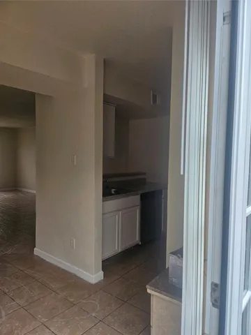a utility room with a sink dryer and washer