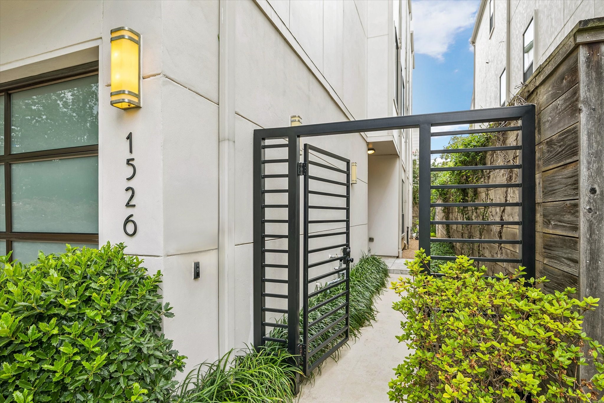 1526 Vermont Street Houston, TX 77006 - Photo 3 of 39 Gated side entry offers privacy and a secure approach to the home.