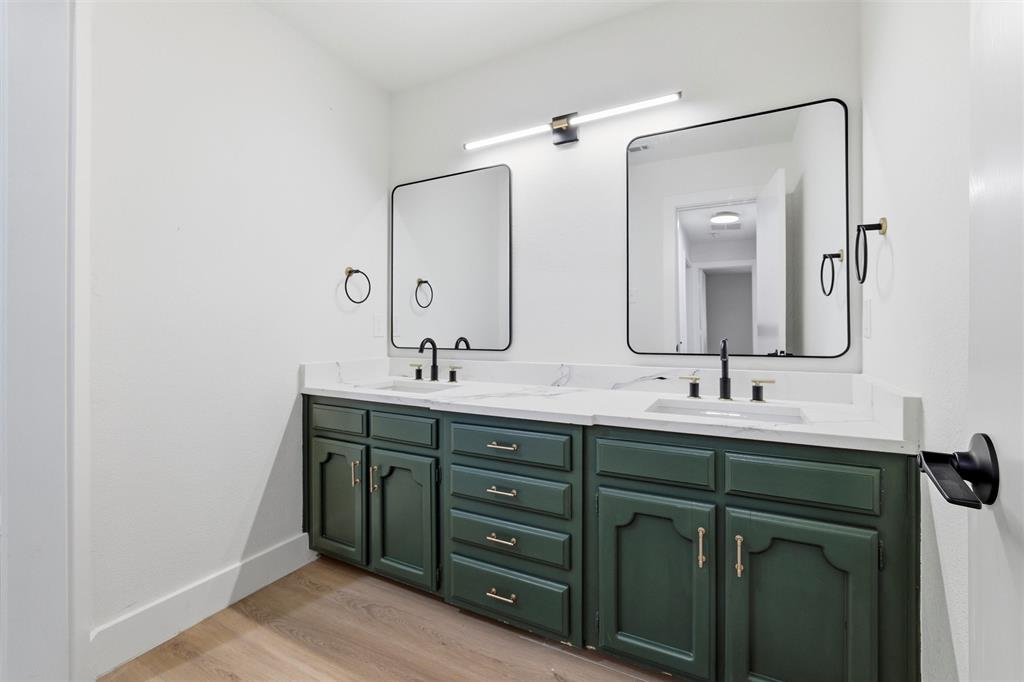 3909 Rustic Forest Trail Arlington, TX 76016 - Photo 11 of 14 a bathroom with double vanity sinks and a mirror