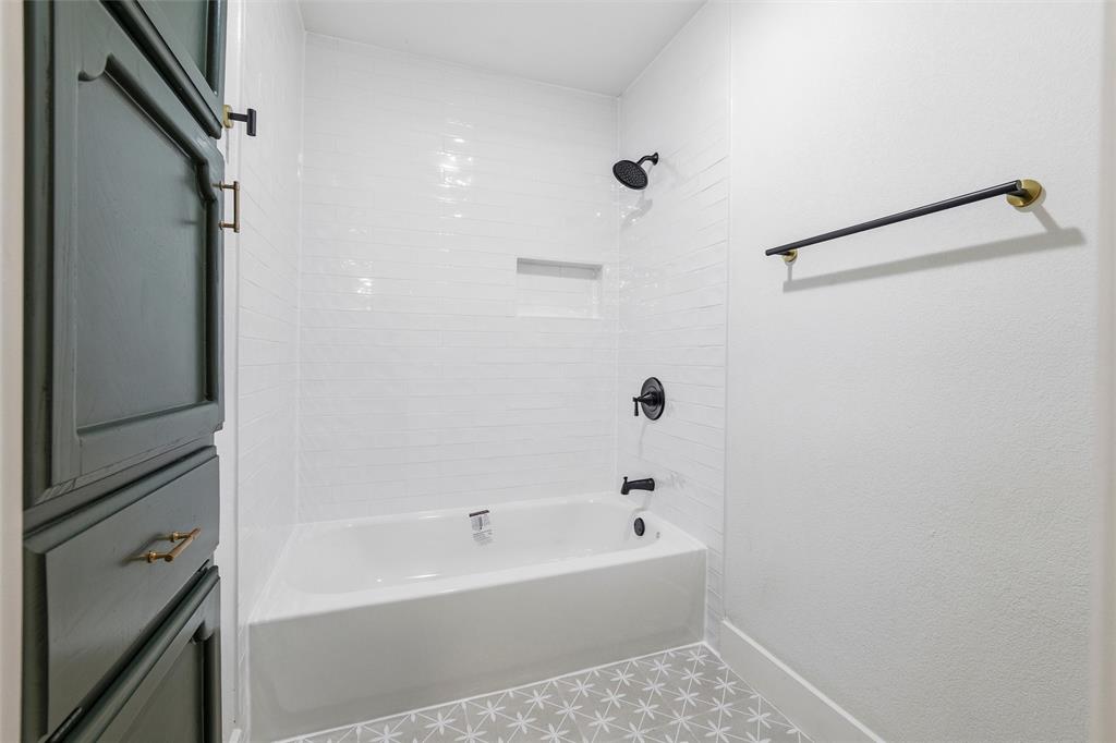 3909 Rustic Forest Trail Arlington, TX 76016 - Photo 12 of 14 a bathroom with a bathtub and a shower