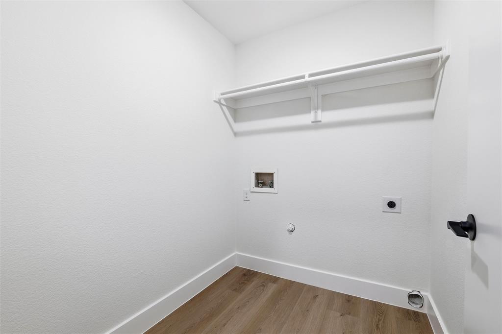 3909 Rustic Forest Trail Arlington, TX 76016 - Photo 13 of 14 a view of a room with racks on the wall