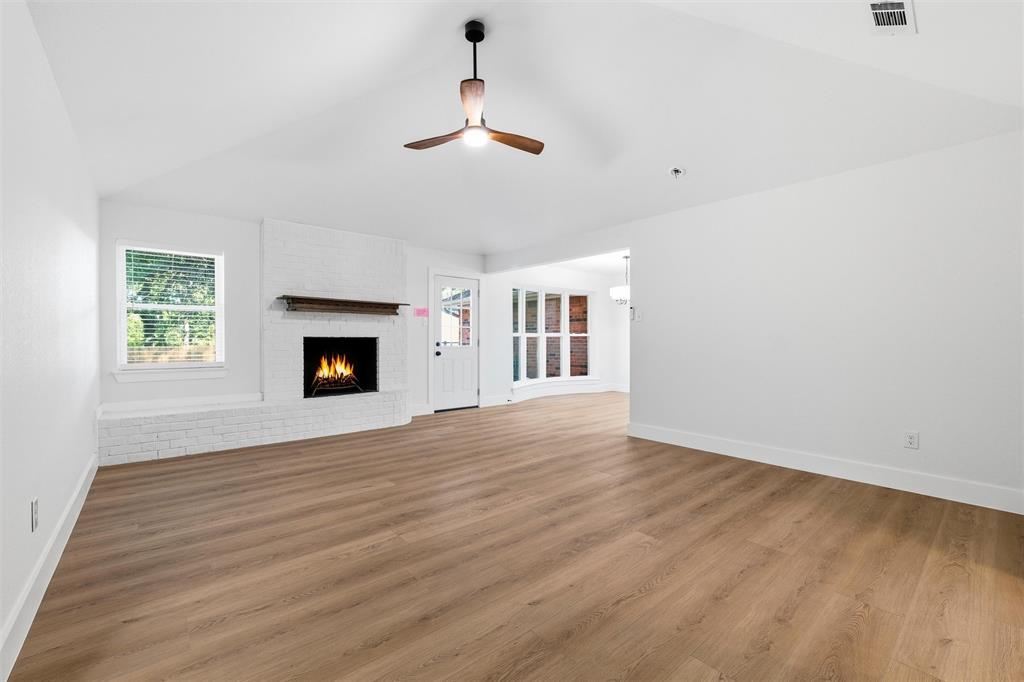 3909 Rustic Forest Trail Arlington, TX 76016 - Photo 3 of 14 an empty room with windows and fireplace