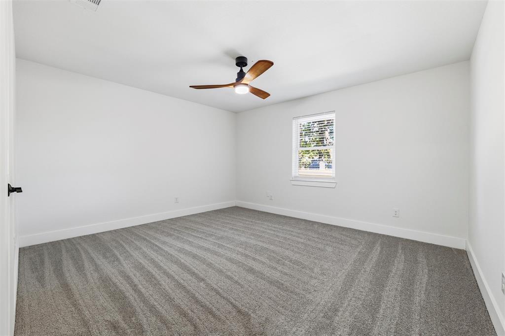 3909 Rustic Forest Trail Arlington, TX 76016 - Photo 9 of 14 an empty room with windows and fan