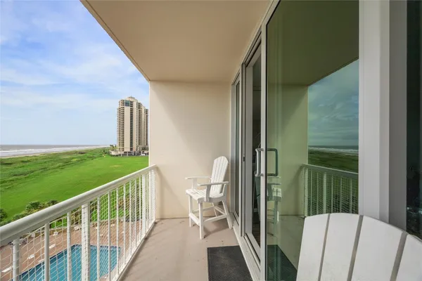 a view of balcony with furniture