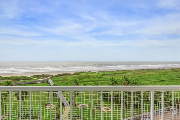 a view of a balcony with an ocean