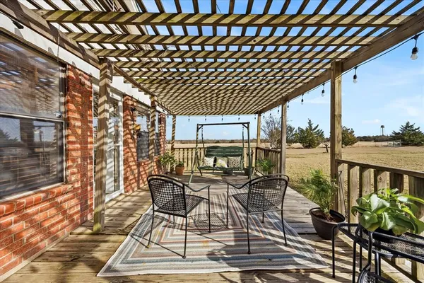 a view of a chairs and table in the patio