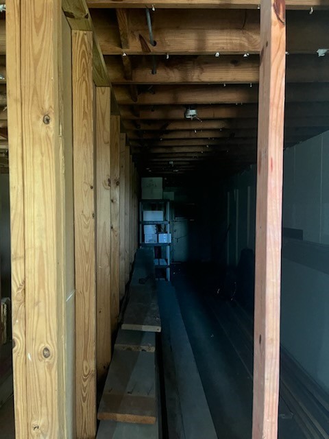 4509 Mowery Road Houston, TX 77047 - Photo 4 of 5 Interior Renovation – Interior corridor with exposed framing, ready for customization and redevelopment.