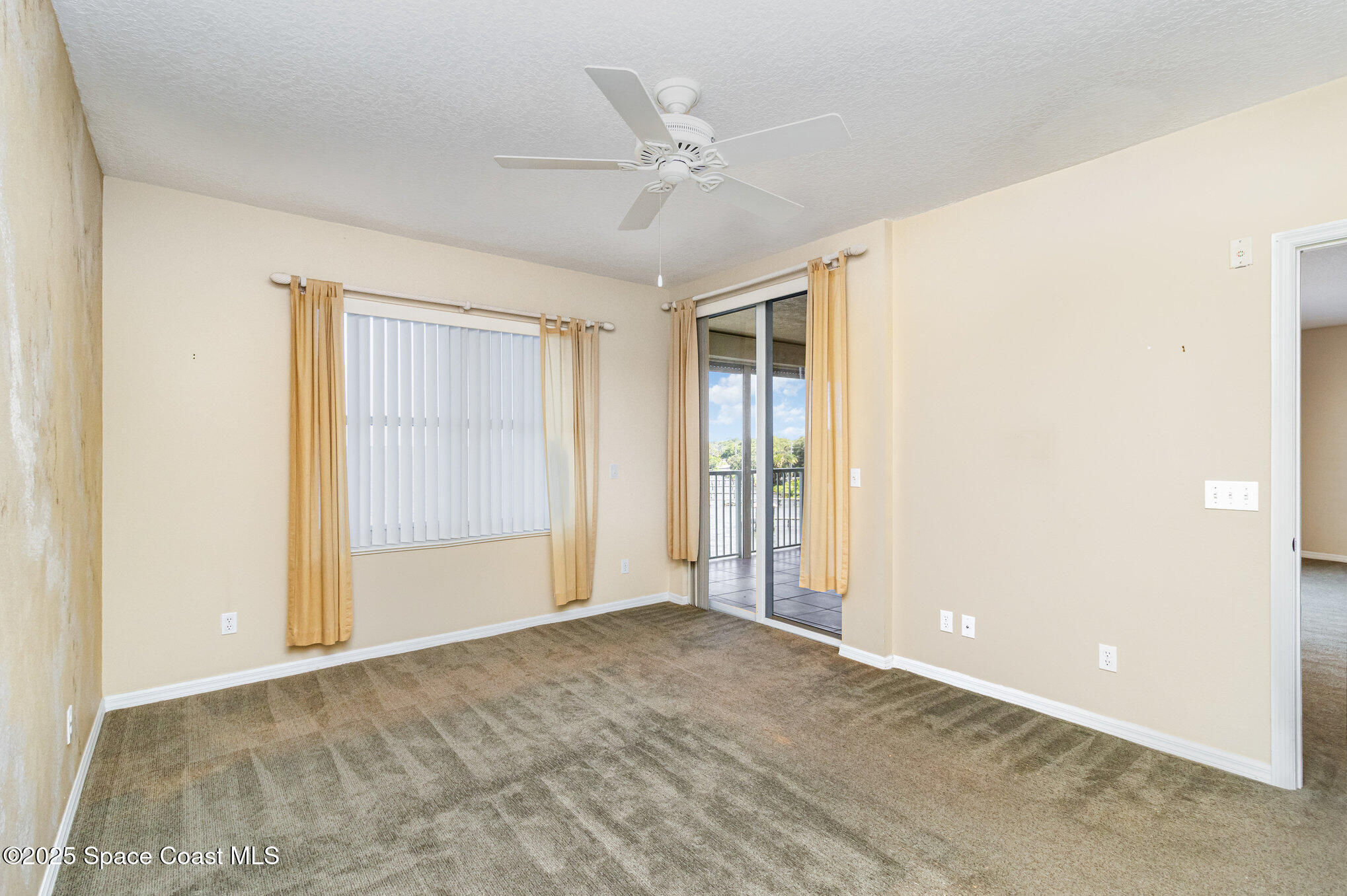 104 Riverside Drive, Unit 403 Cocoa, FL 32922 - Photo 11 of 20 an empty room with closet and ceiling fan