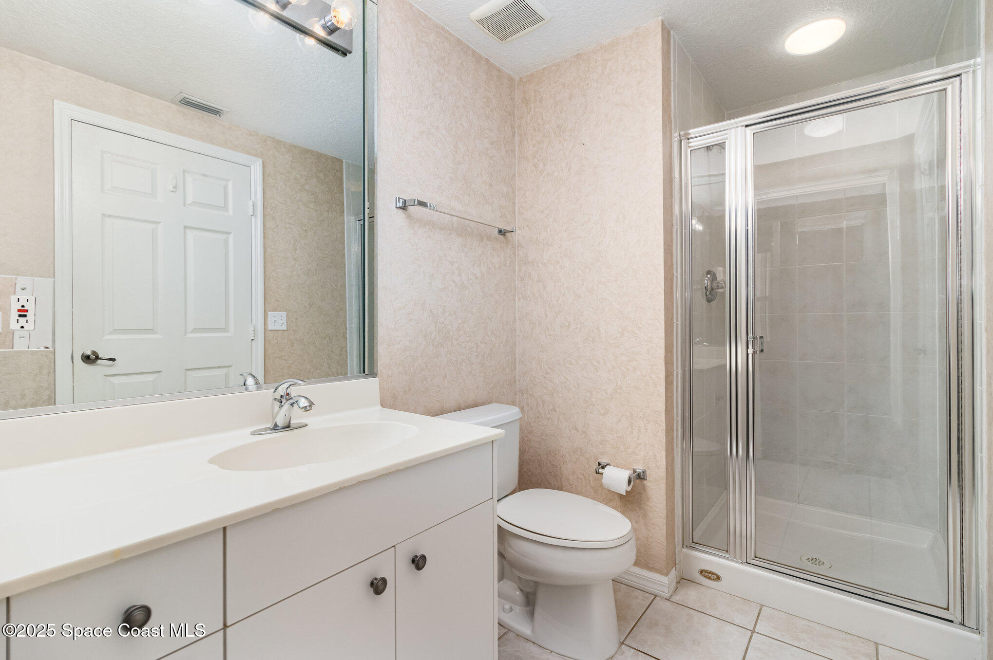 104 Riverside Drive, Unit 403 Cocoa, FL 32922 - Photo 18 of 20 a bathroom with a sink a toilet and shower