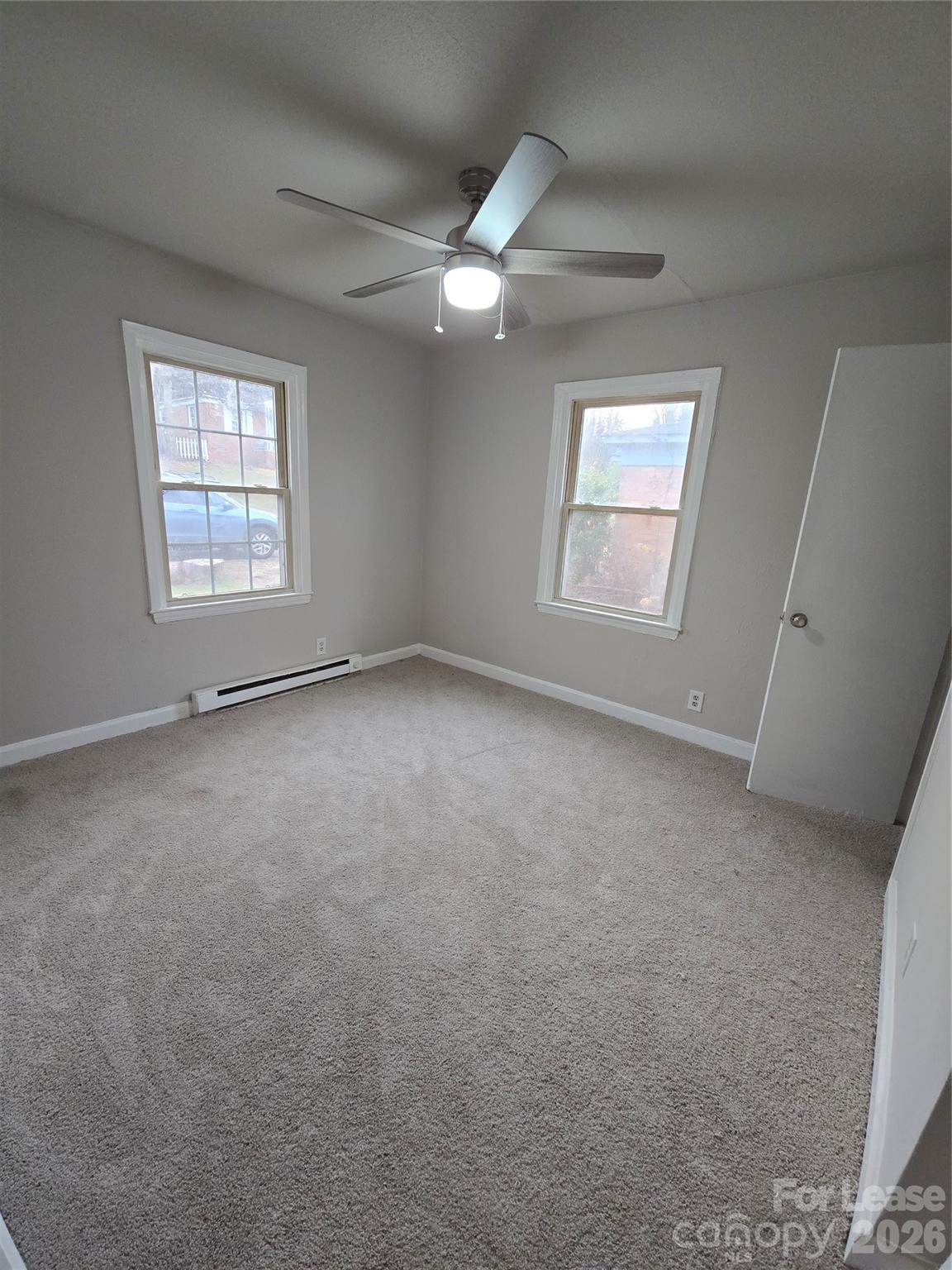638 Miller Street Charlotte, NC 28203 - Photo 6 of 13 an empty room with windows and fan