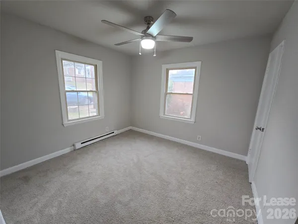 a bathroom with a toilet and a bathtub
