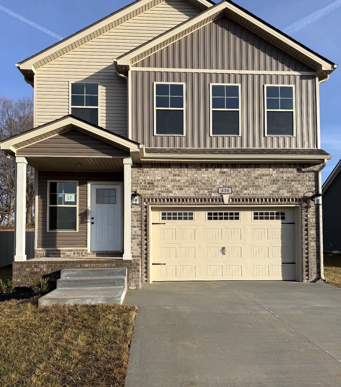 a front view of a house with a garage