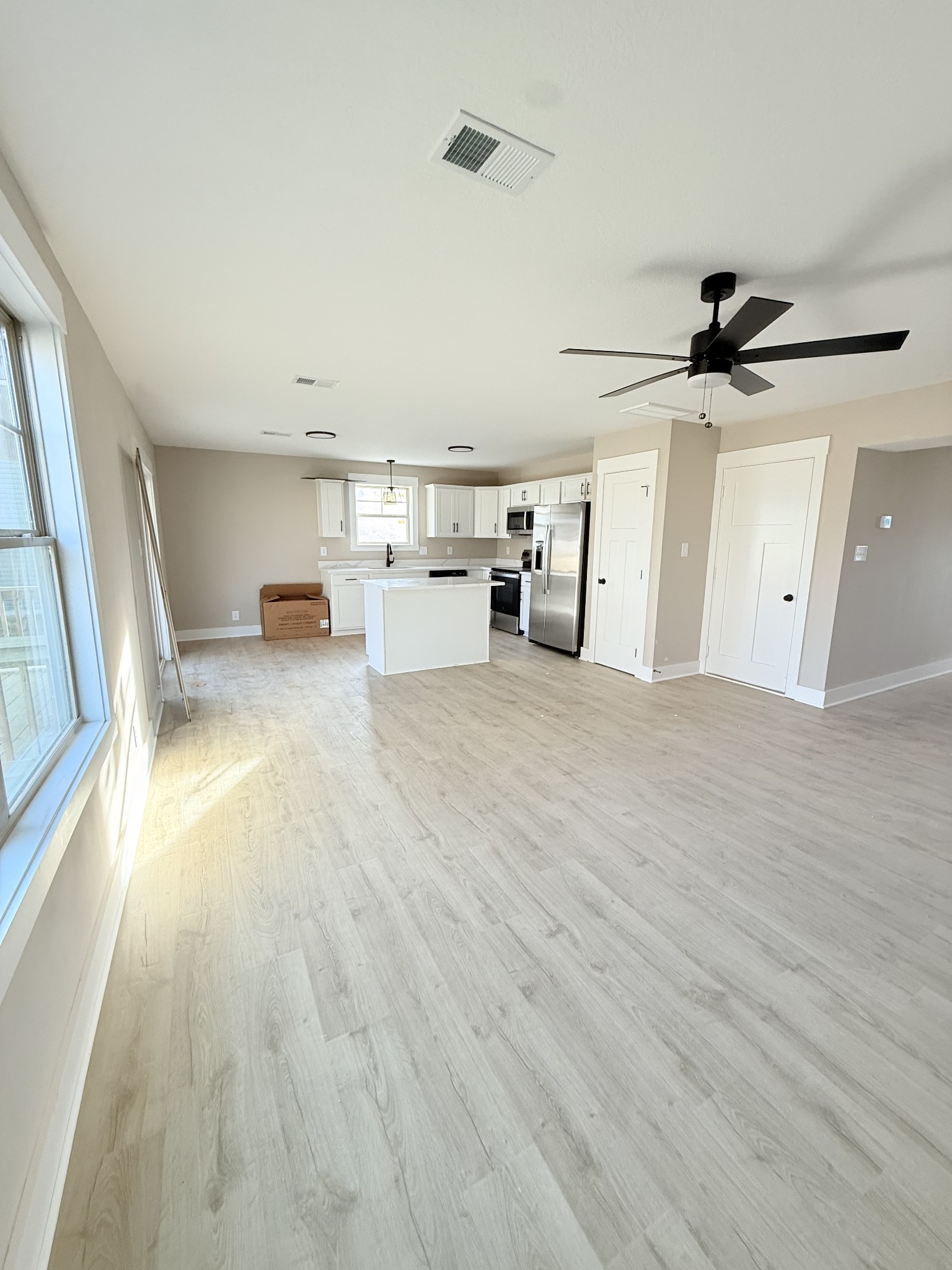 17 Echo Ridge Oak Grove, KY 42262 - Photo 4 of 13 a view of a kitchen with furniture and a ceiling fan
