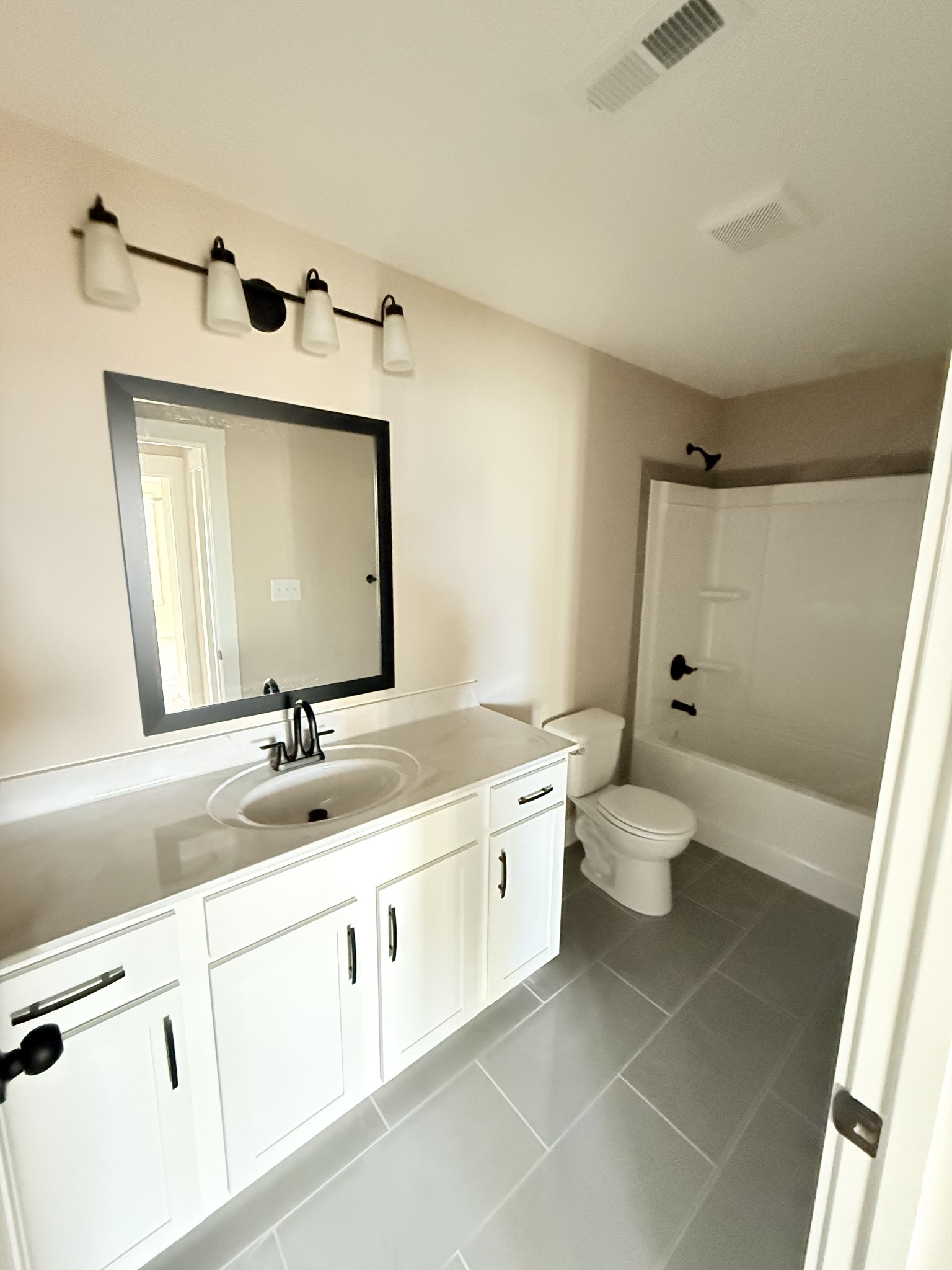 17 Echo Ridge Oak Grove, KY 42262 - Photo 9 of 13 a bathroom with a double vanity sink toilet and mirror
