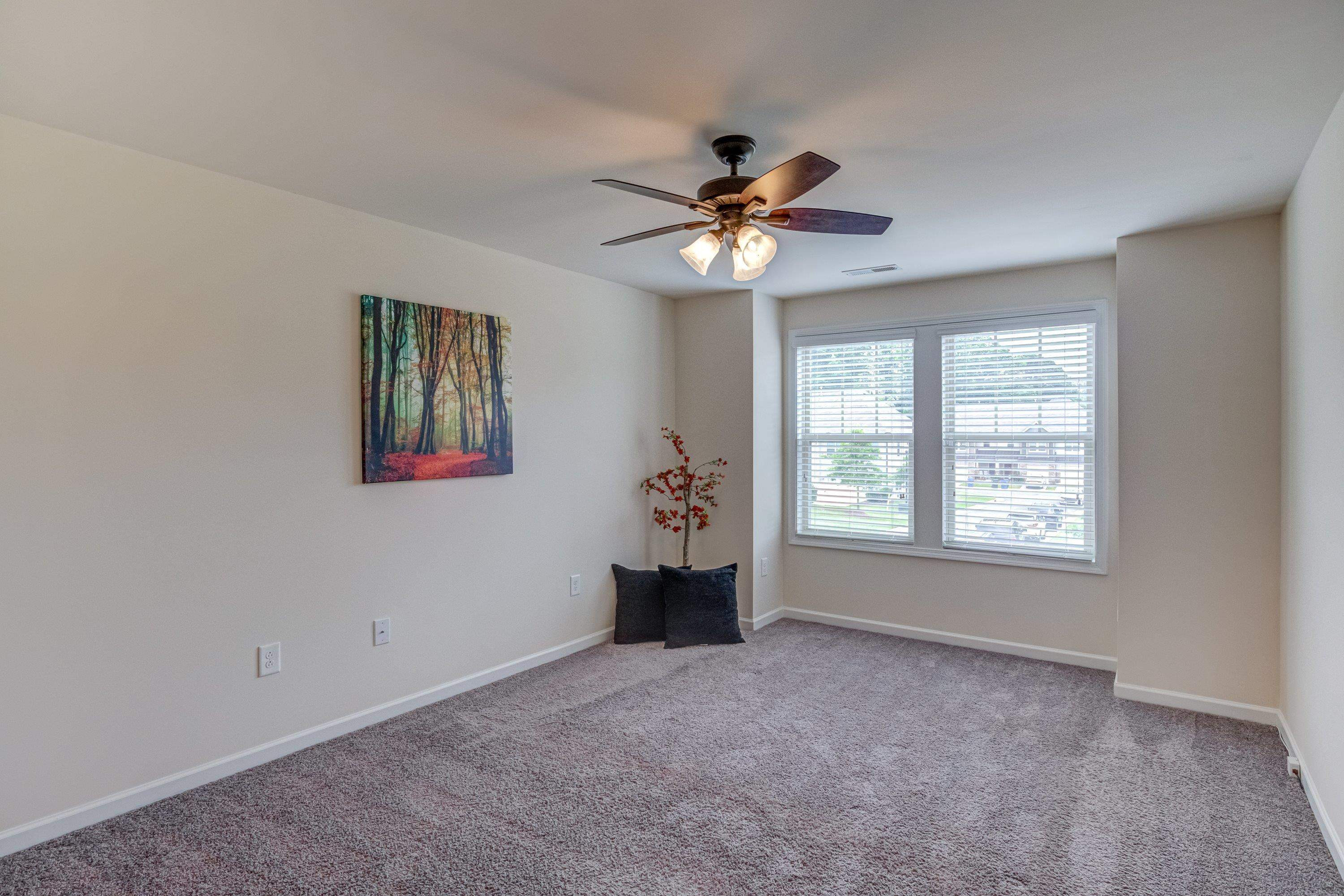 7817 Elmshire Way Raleigh, NC 27616 - Photo 24 of 46 a view of an empty room with a window