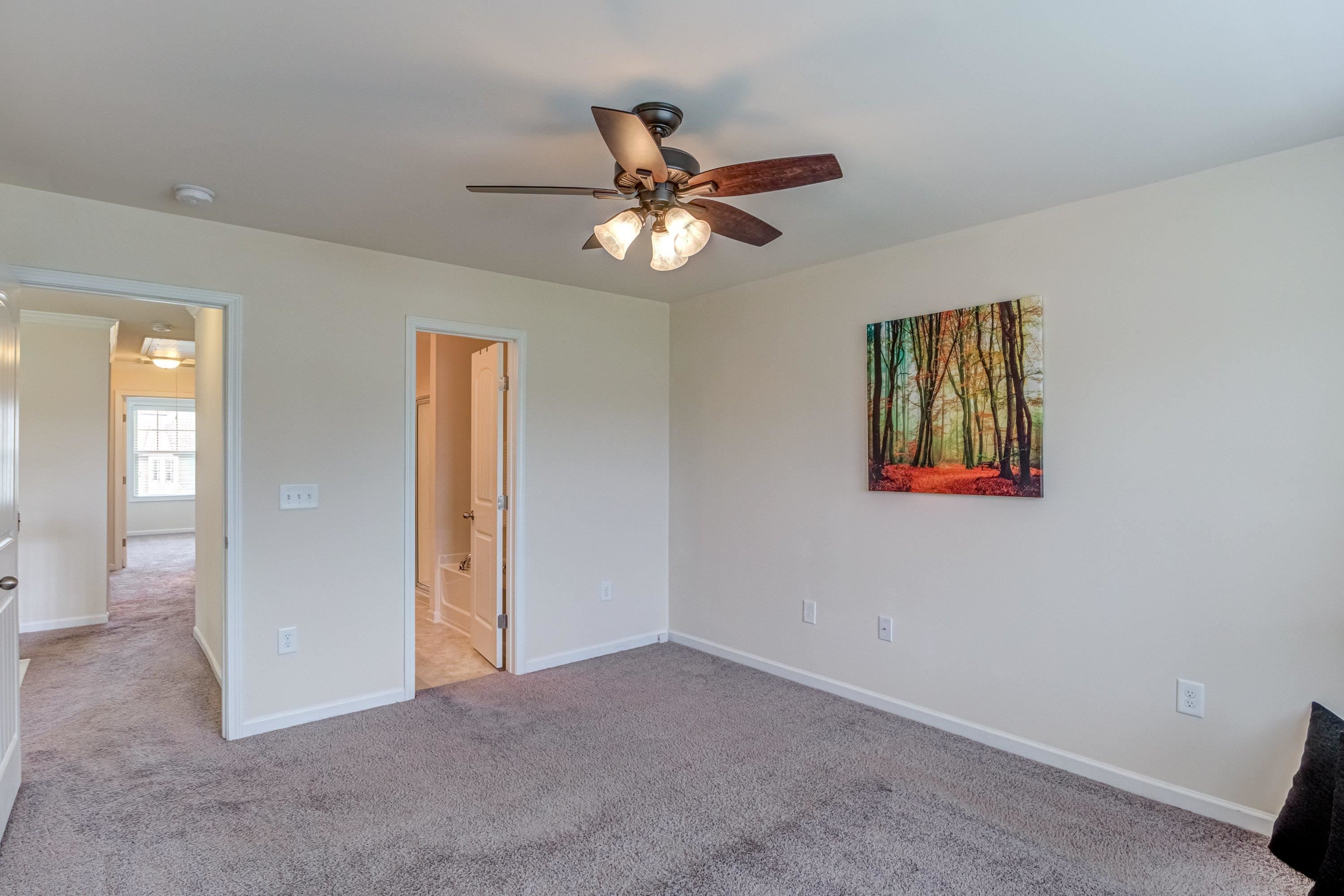 7817 Elmshire Way Raleigh, NC 27616 - Photo 26 of 46 wooden floor in an empty room with a window