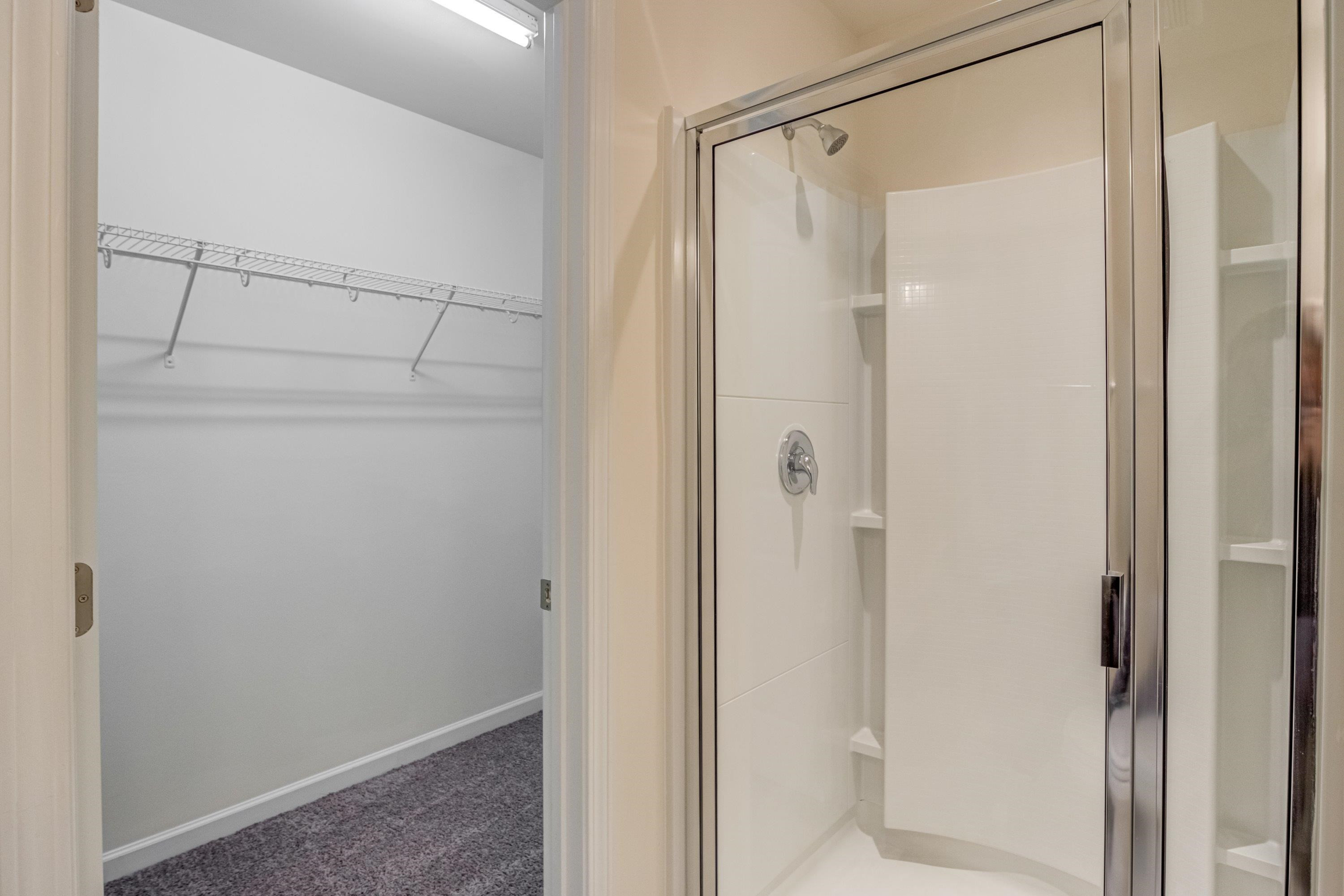 7817 Elmshire Way Raleigh, NC 27616 - Photo 29 of 46 a bathroom with a glass shower door