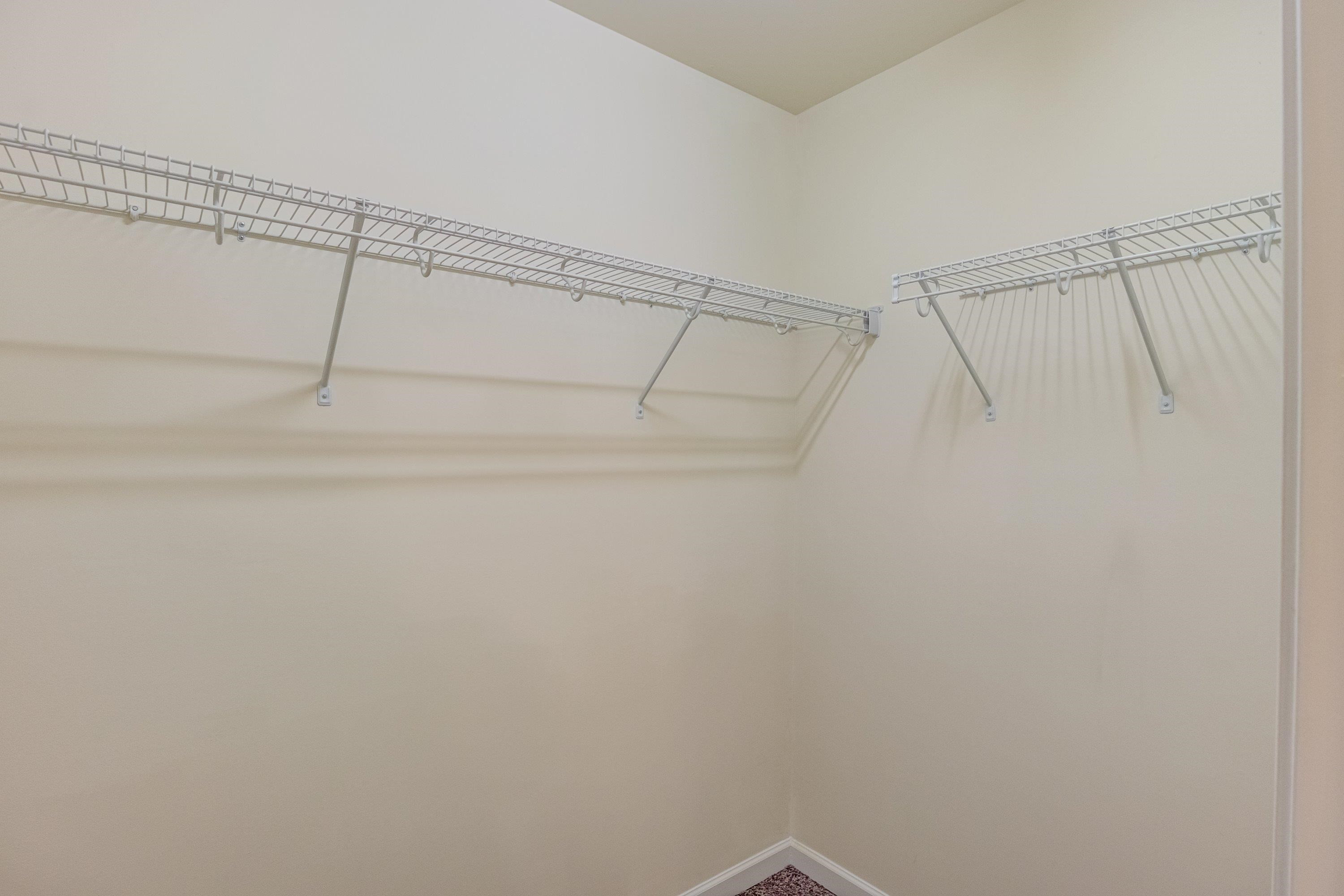 7817 Elmshire Way Raleigh, NC 27616 - Photo 30 of 46 a view of a room with racks on the wall