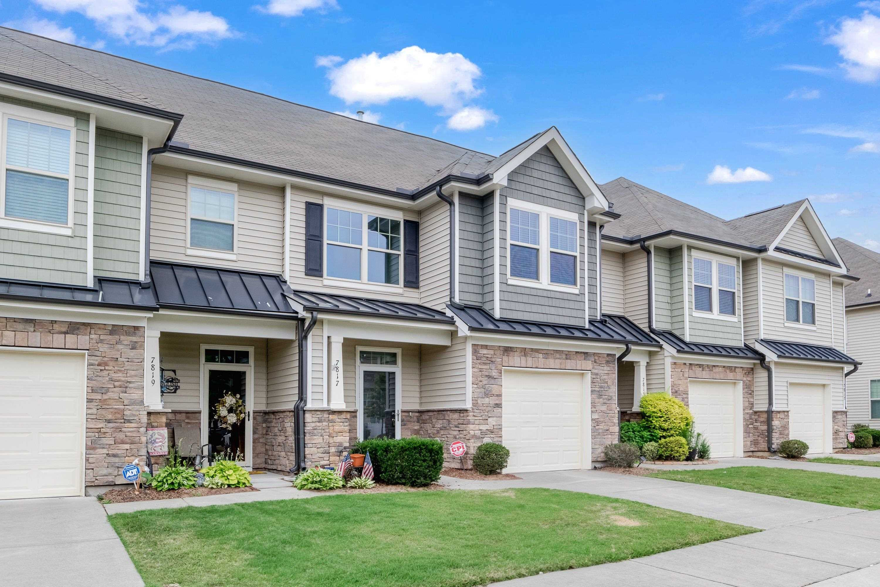7817 Elmshire Way Raleigh, NC 27616 - Photo 3 of 46 a front view of a house with a yard and garage