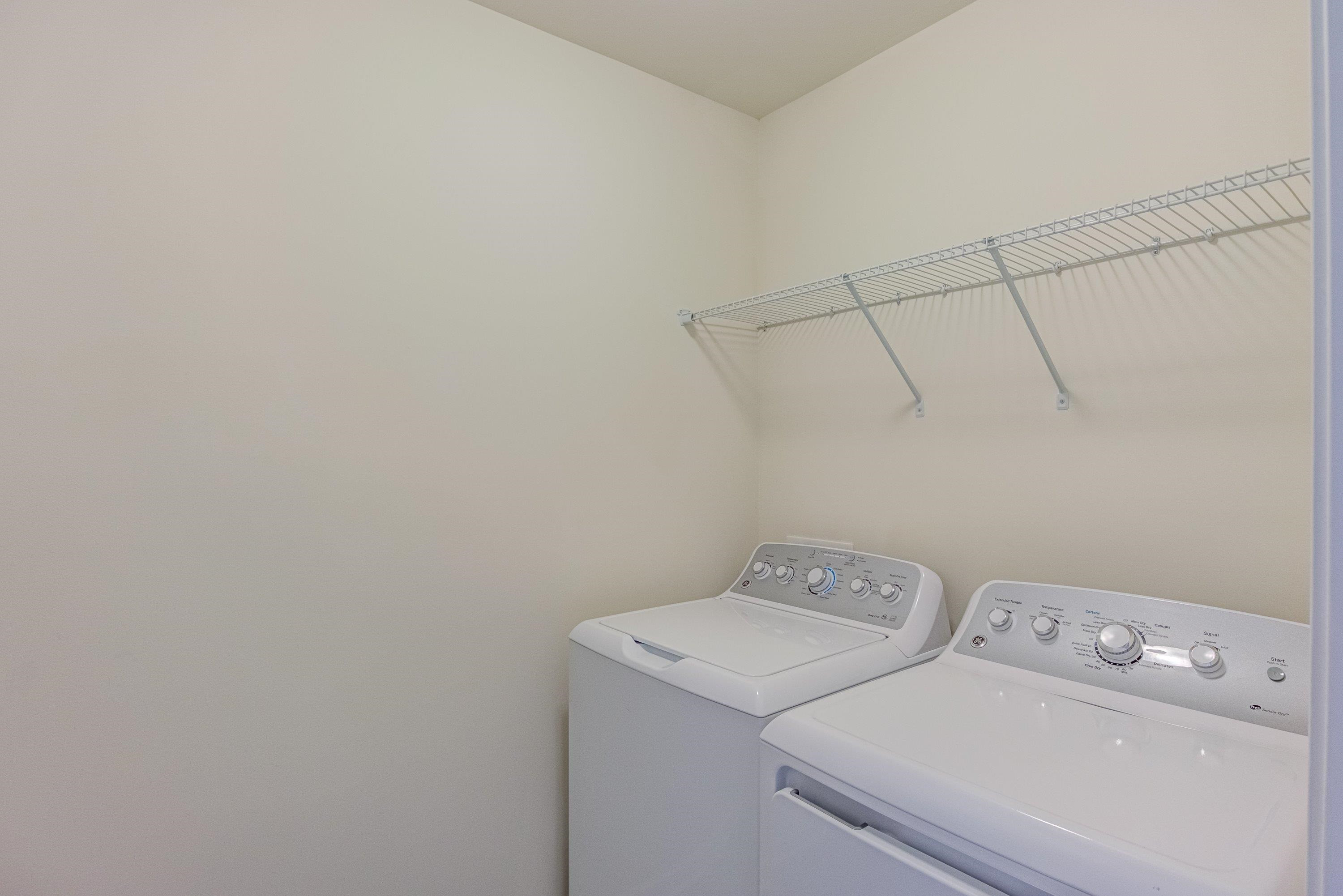 7817 Elmshire Way Raleigh, NC 27616 - Photo 31 of 46 a utility room with dryer and washer