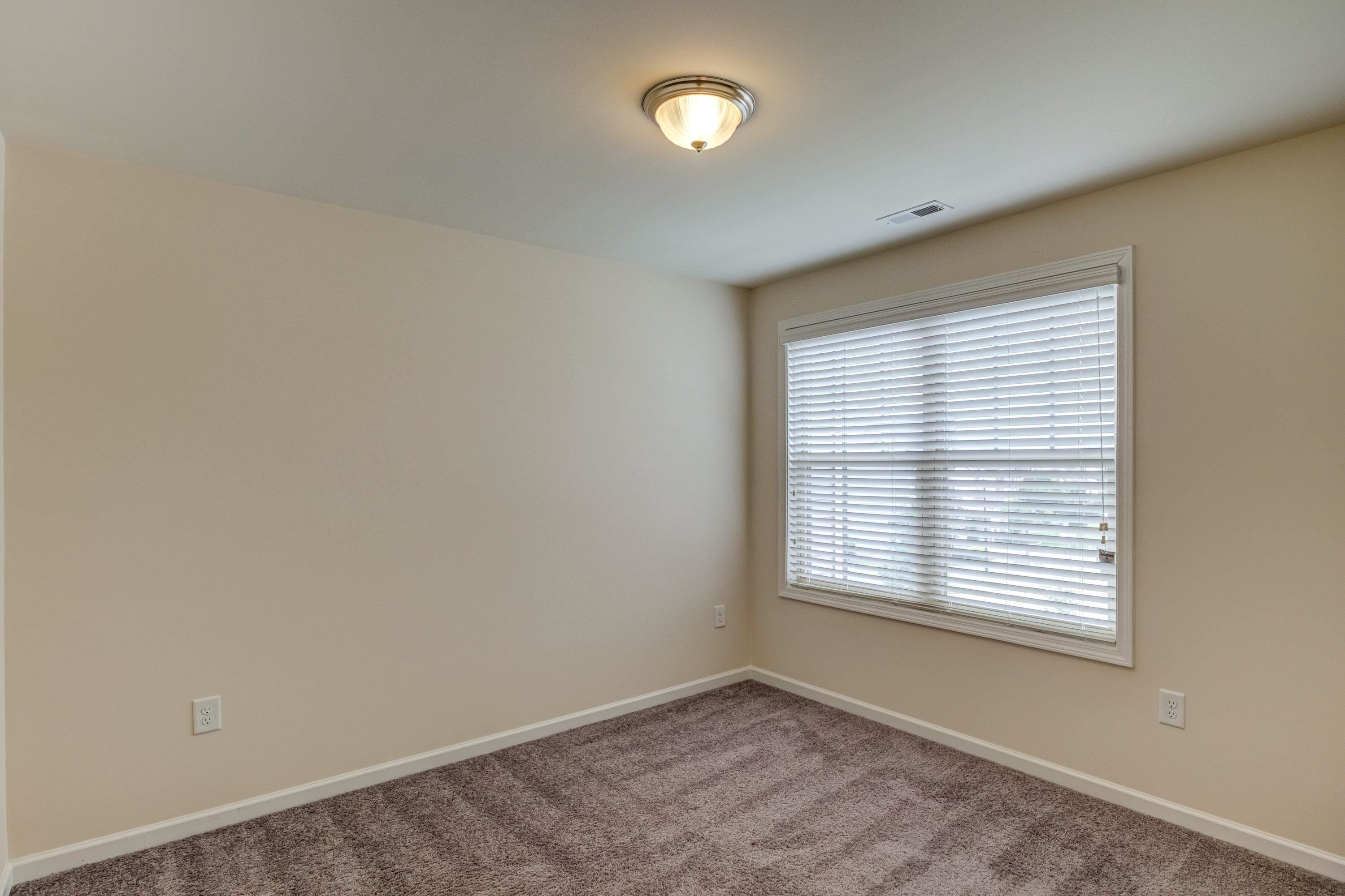 7817 Elmshire Way Raleigh, NC 27616 - Photo 33 of 46 a view of an empty room with a window