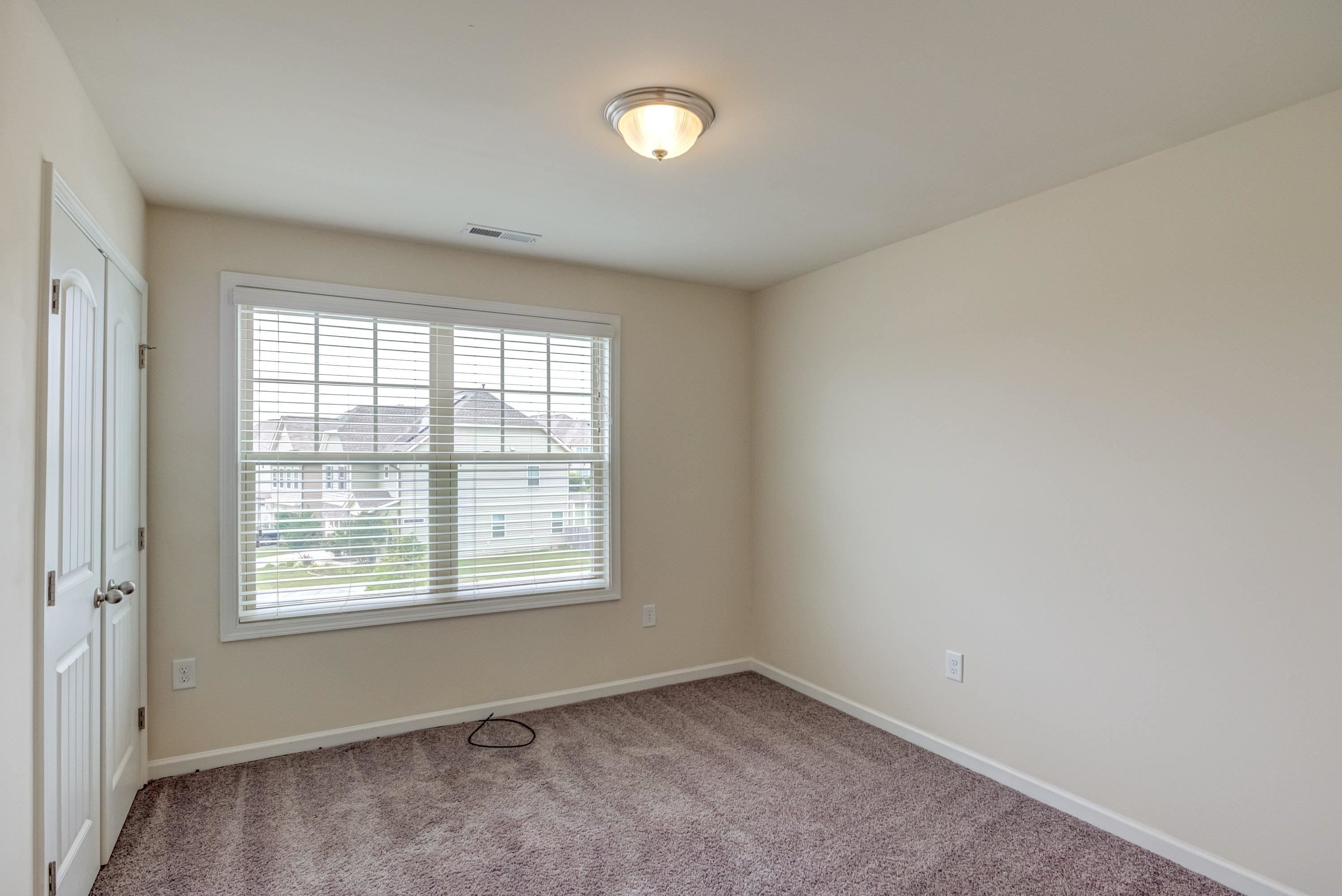 7817 Elmshire Way Raleigh, NC 27616 - Photo 35 of 46 a view of an empty room with a window