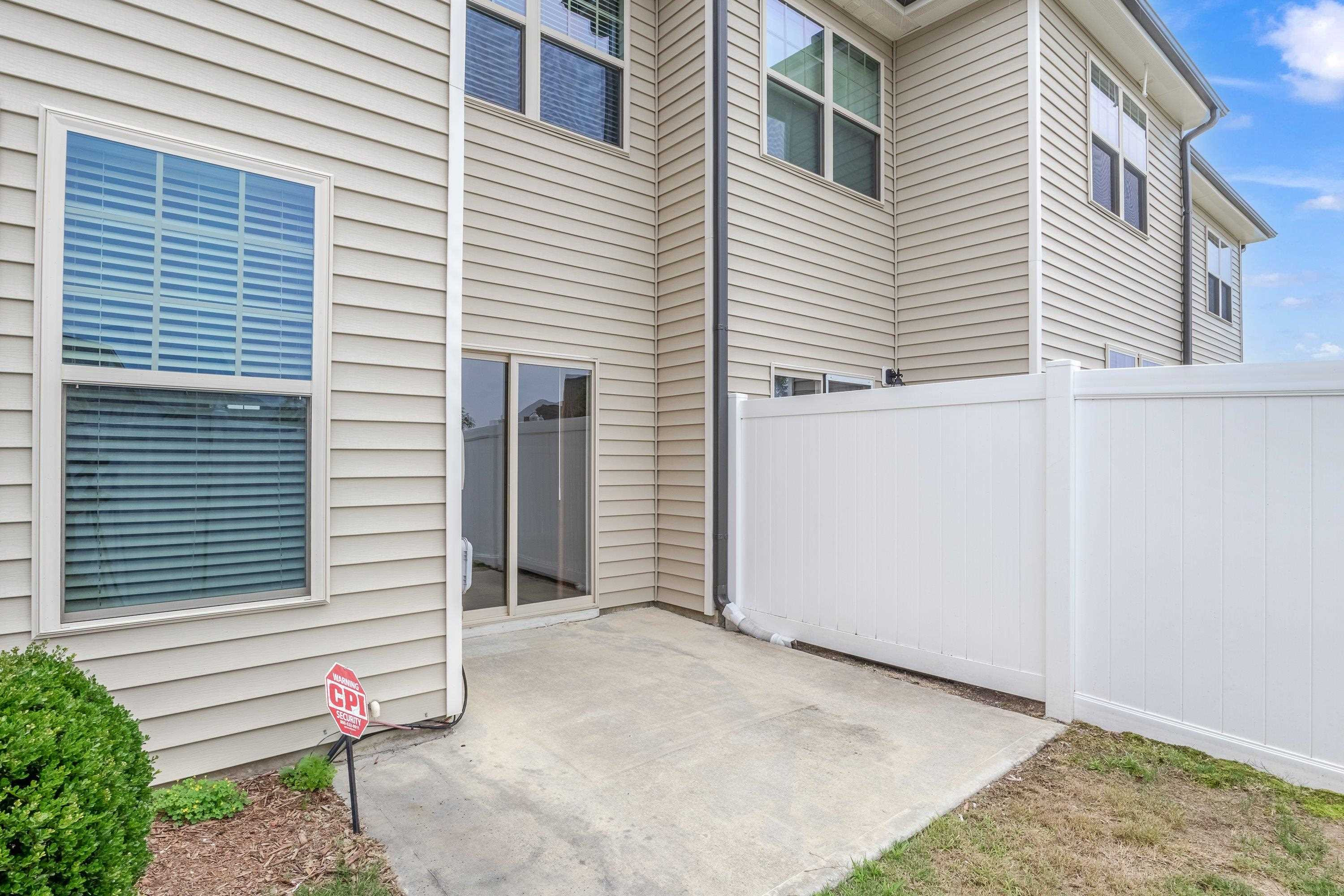 7817 Elmshire Way Raleigh, NC 27616 - Photo 37 of 46 a view of a house with a yard and garage