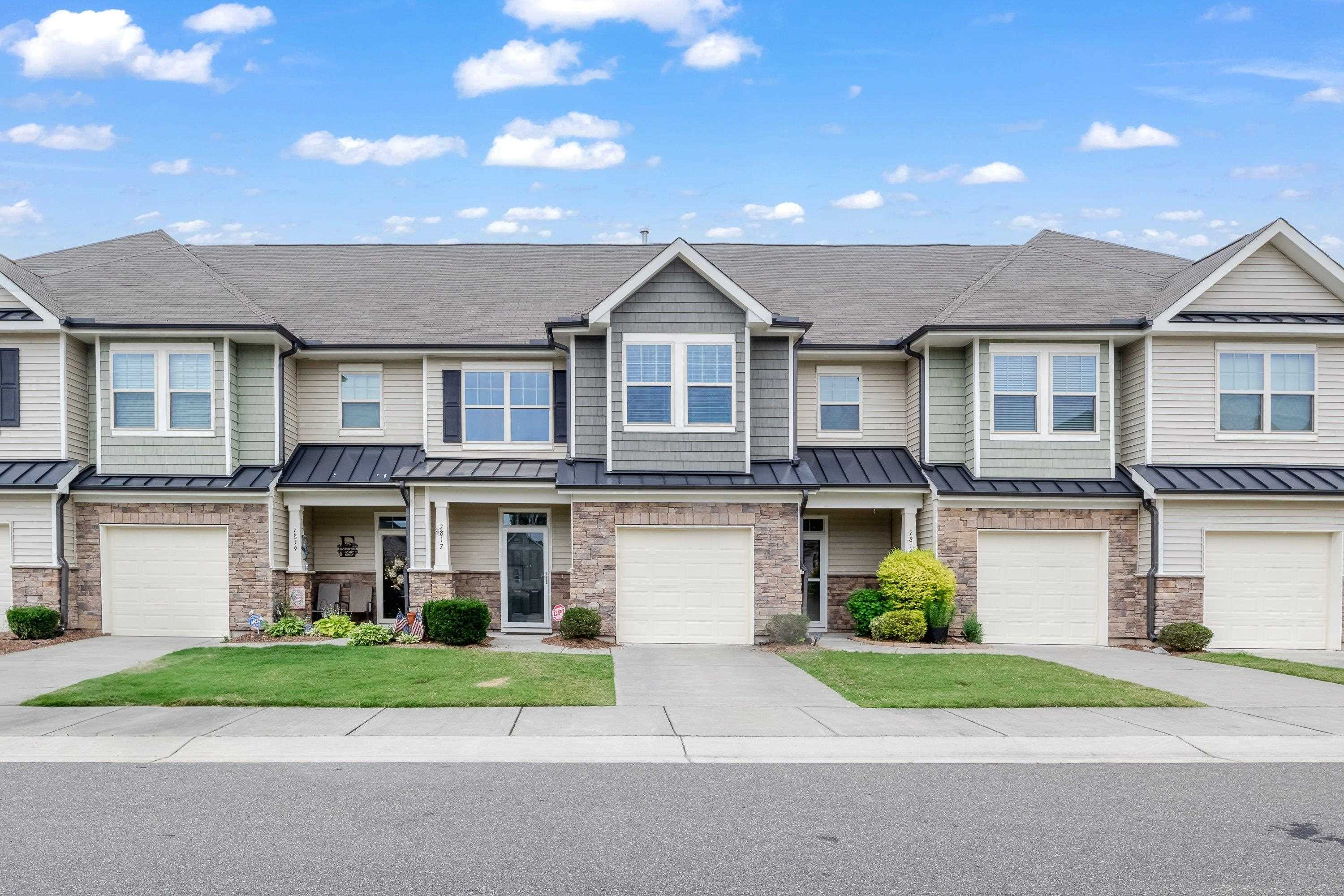 7817 Elmshire Way Raleigh, NC 27616 - Photo 44 of 46 a front view of a house with a garden and plants