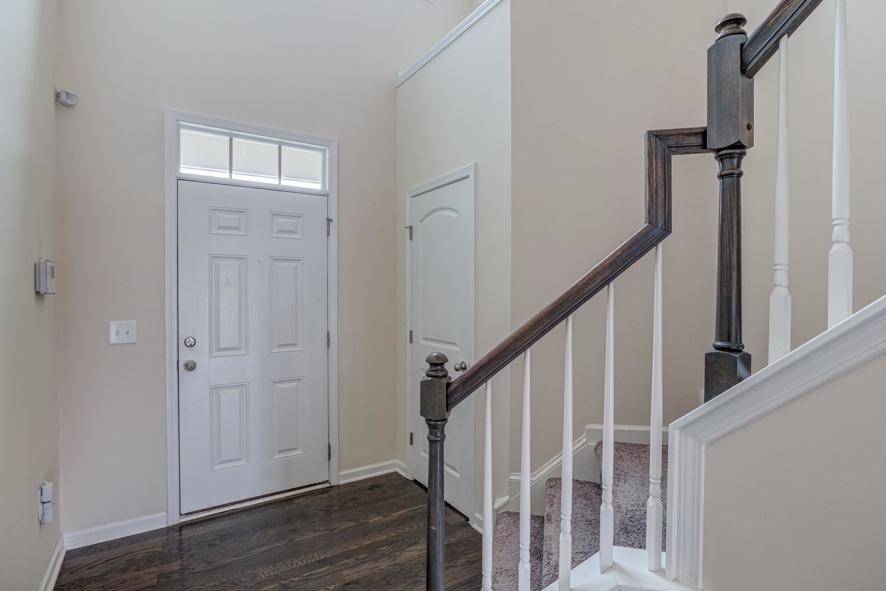 7817 Elmshire Way Raleigh, NC 27616 - Photo 5 of 46 a view of entryway with wooden floor