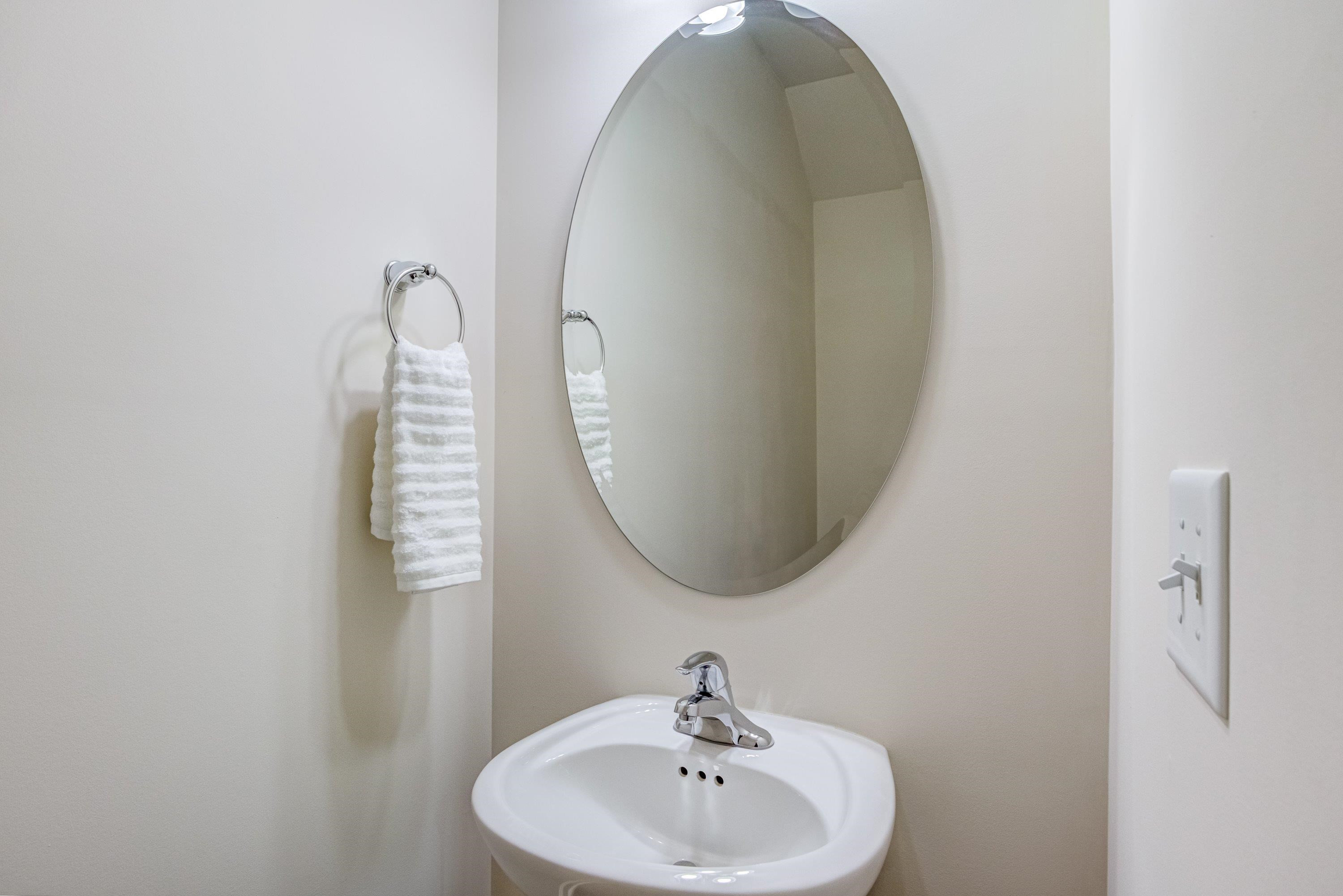 7817 Elmshire Way Raleigh, NC 27616 - Photo 8 of 46 a bathroom with a sink and a mirror