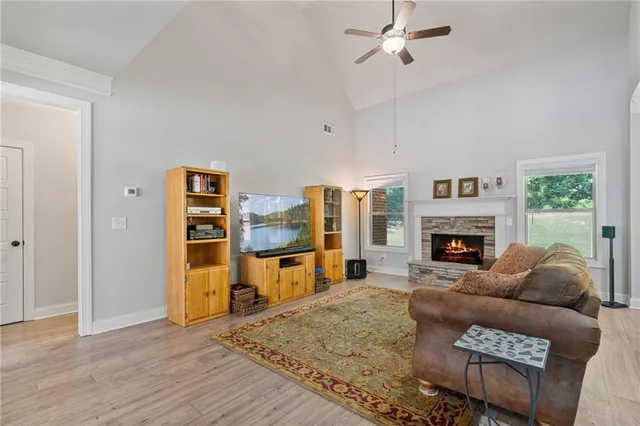 a living room with furniture and a fireplace