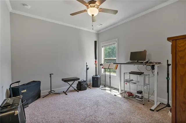 a view of a workspace with furniture and a window