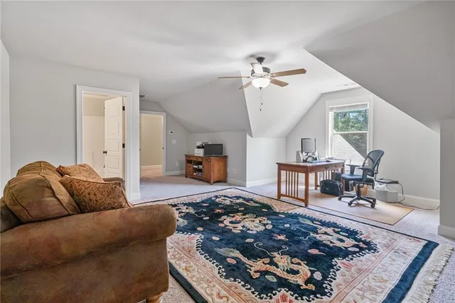 a living room with furniture and a rug