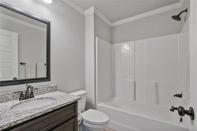 a bathroom with a granite countertop sink toilet tub and shower