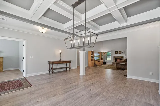 a view of a livingroom with furniture and wooden floor