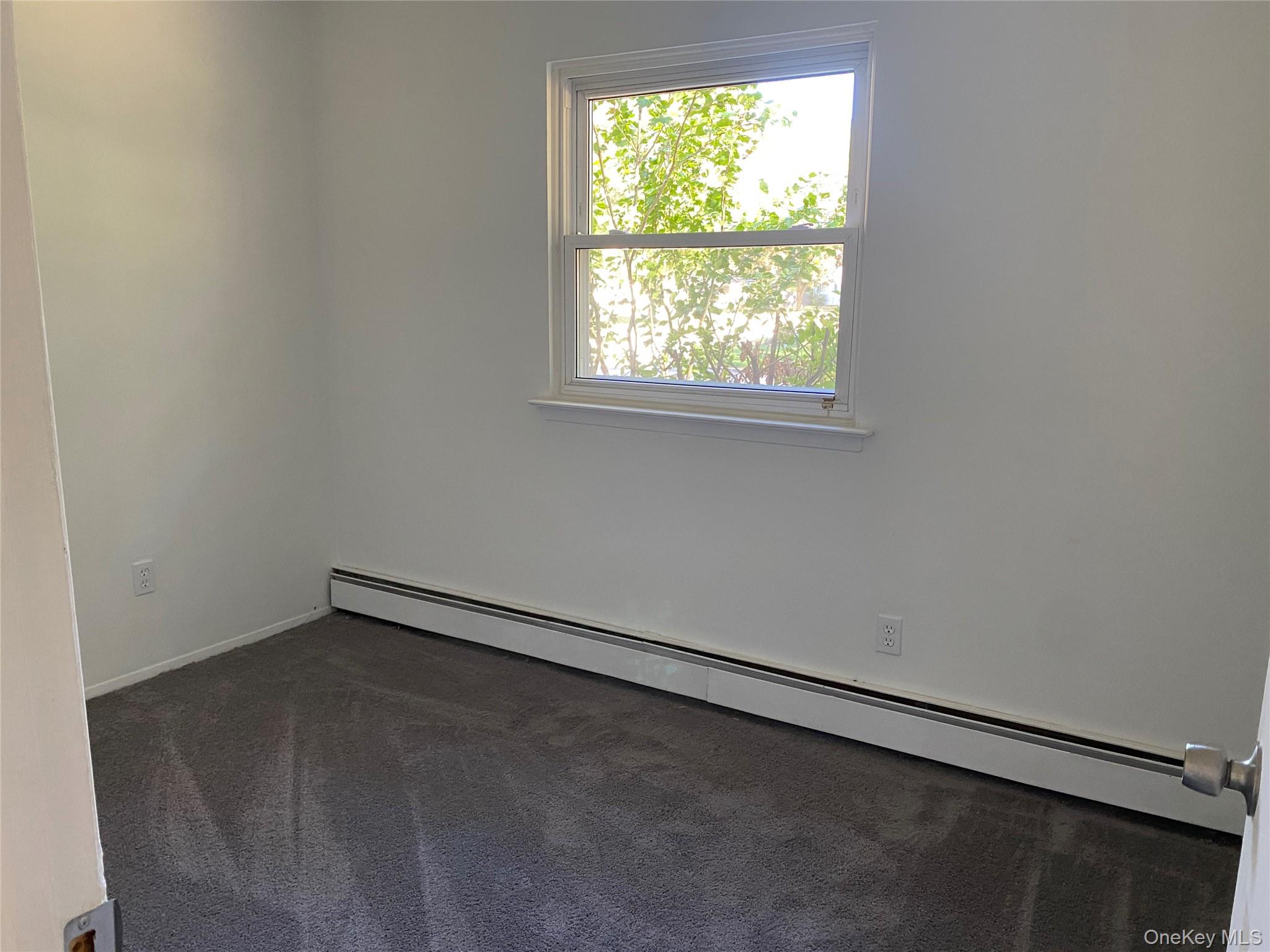 7 Filmore Avenue Coram, NY 11727 - Photo 13 of 22 an empty room with a window