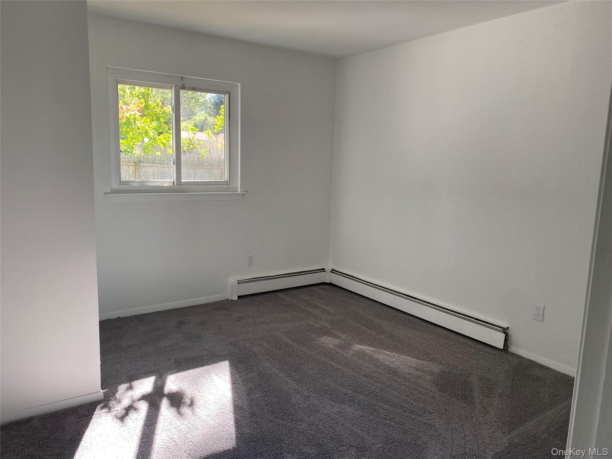 7 Filmore Avenue Coram, NY 11727 - Photo 14 of 22 an empty room with a window