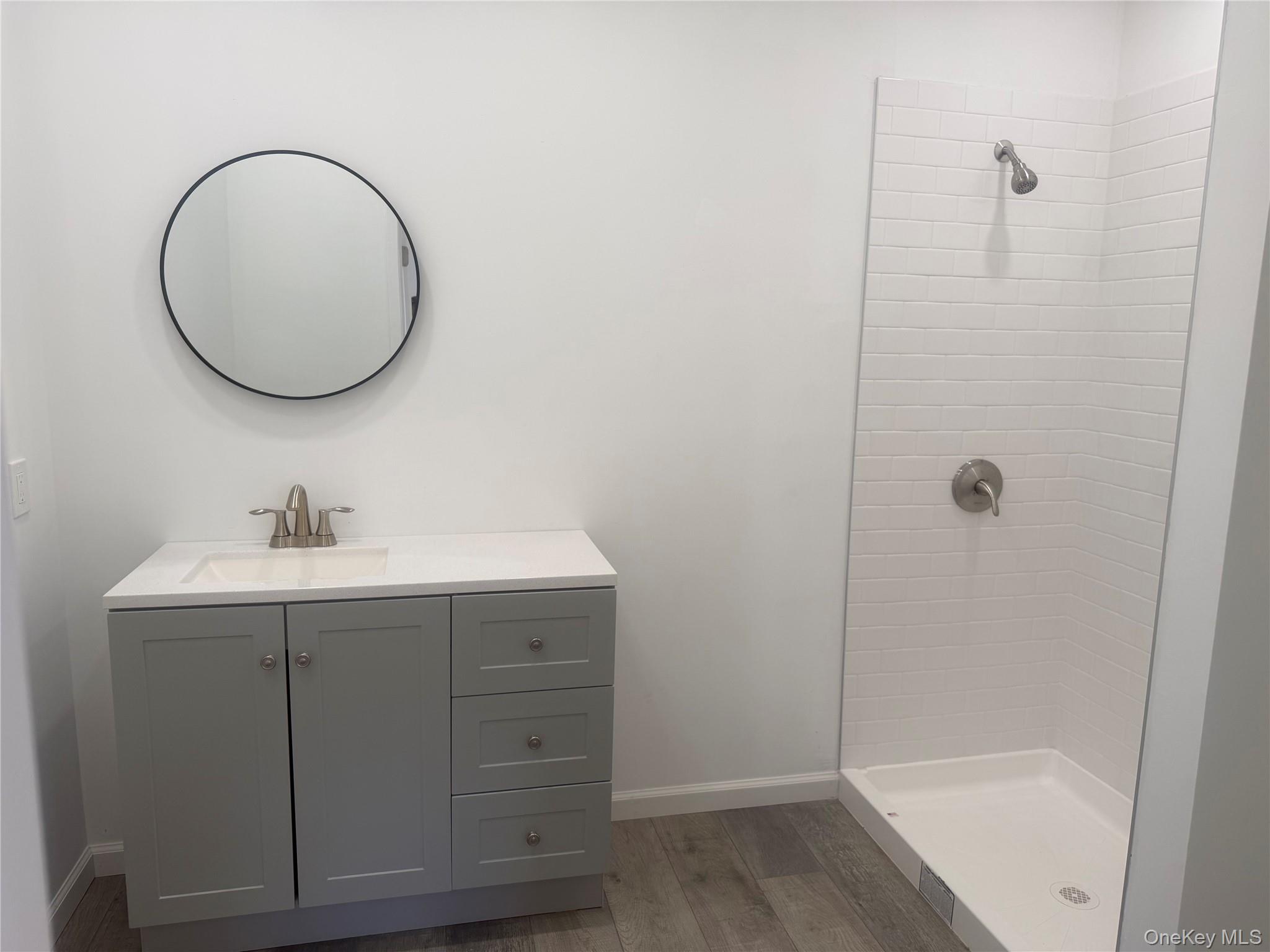7 Filmore Avenue Coram, NY 11727 - Photo 17 of 22 a bathroom with a sink and a mirror