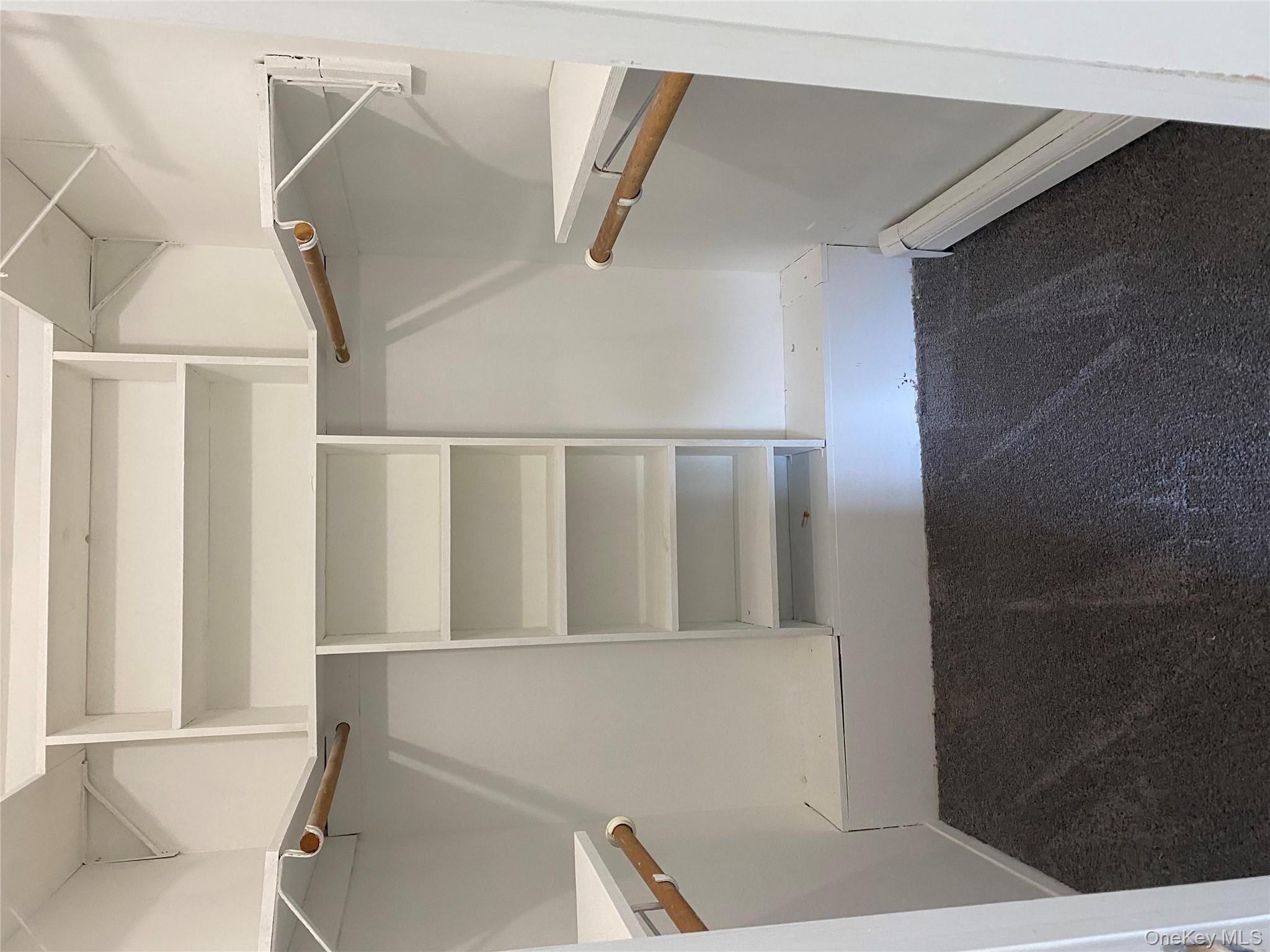 7 Filmore Avenue Coram, NY 11727 - Photo 18 of 22 a view of walk in closet with empty racks