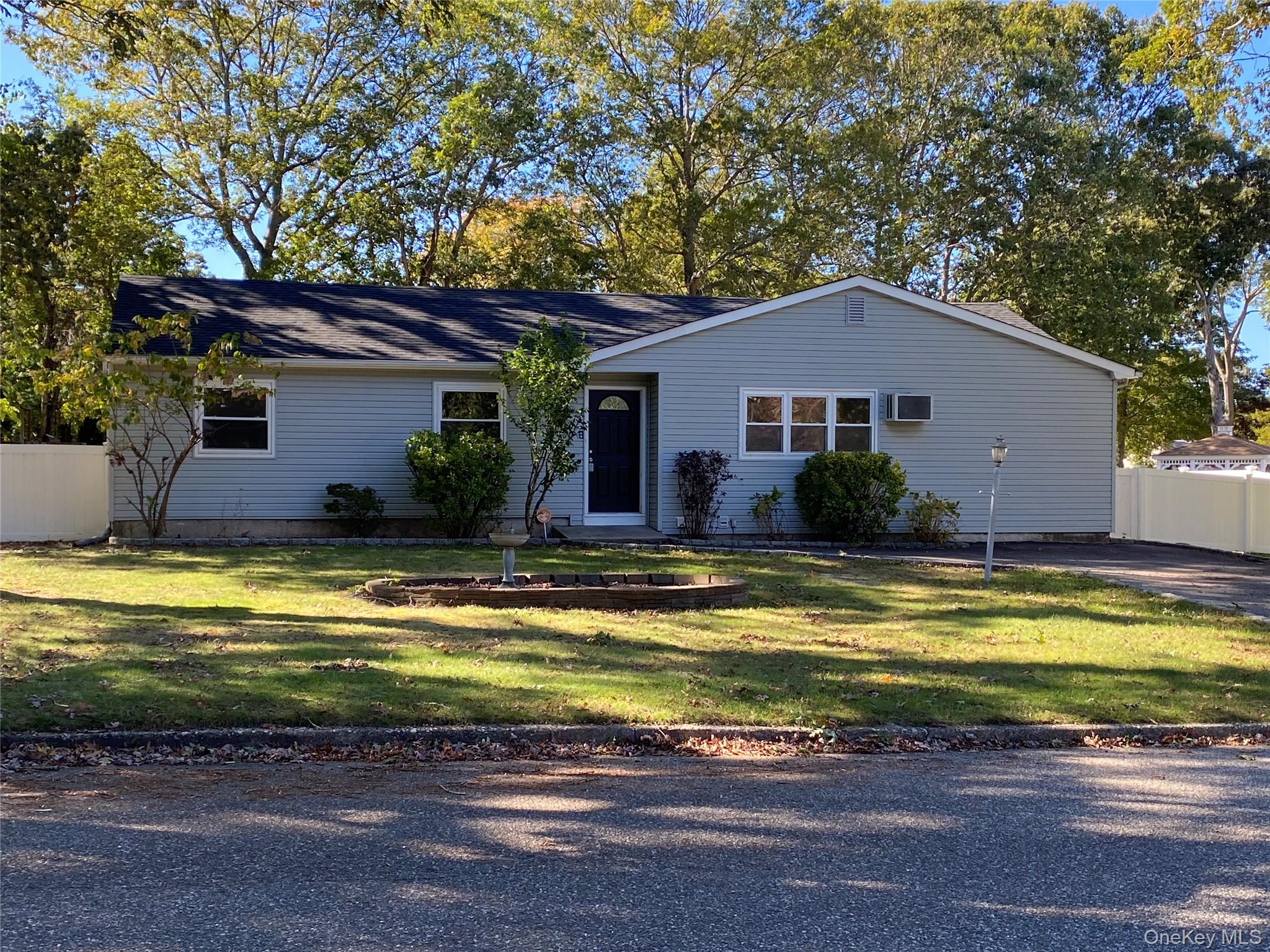 7 Filmore Avenue Coram, NY 11727 - Photo 2 of 22 a view of a house with swimming pool
