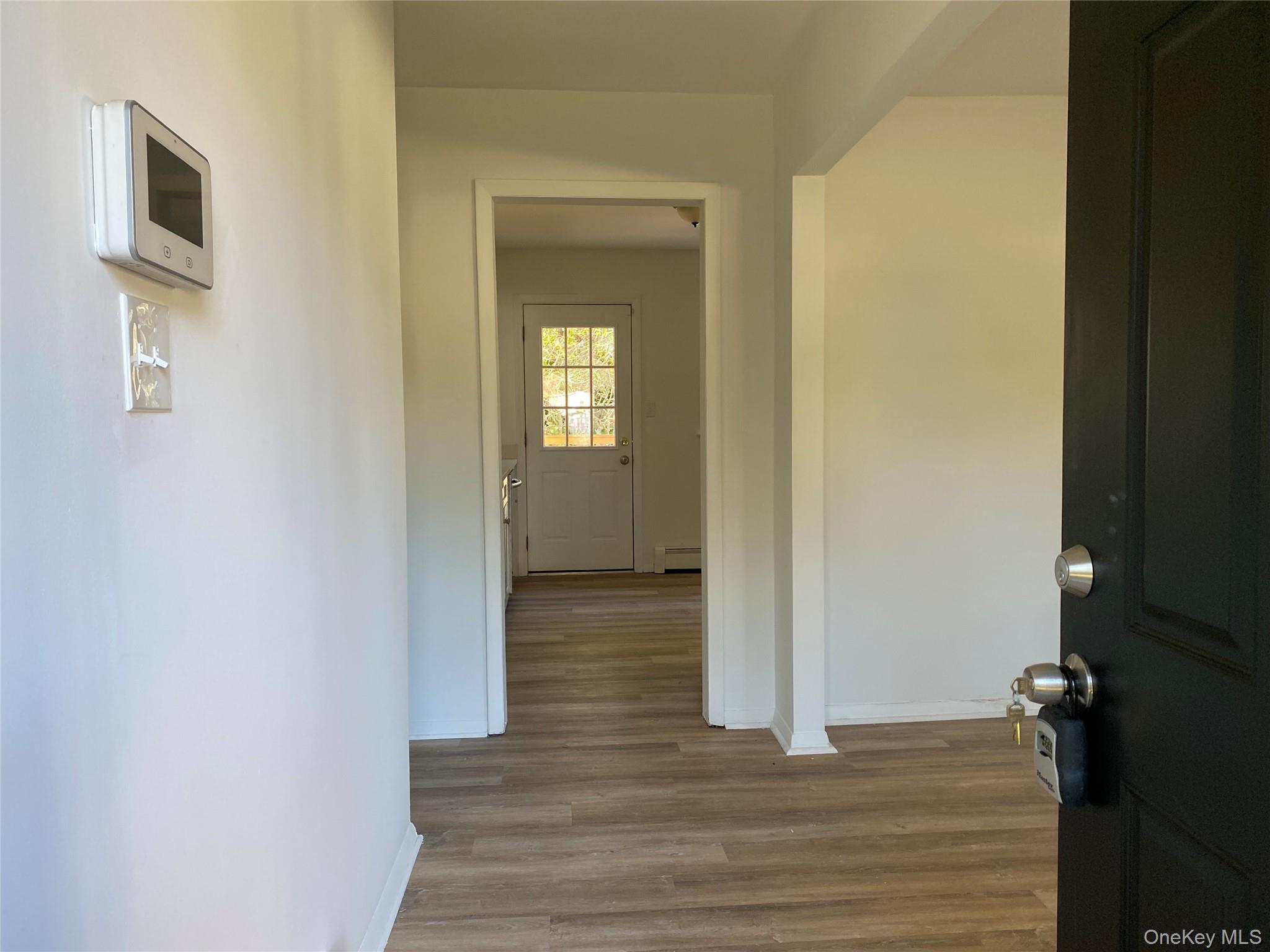 7 Filmore Avenue Coram, NY 11727 - Photo 3 of 22 a view of a hallway with wooden floor