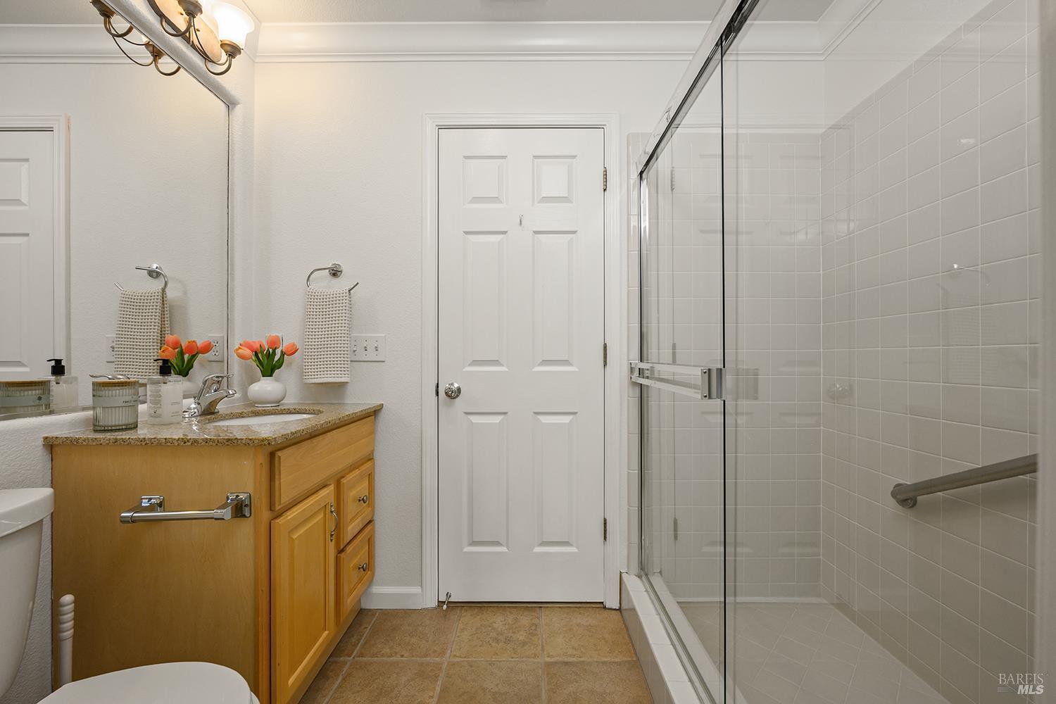 38 Maybeck Street Novato, CA 94949 - Photo 38 of 47 a bathroom with a granite countertop sink mirror vanity and toilet