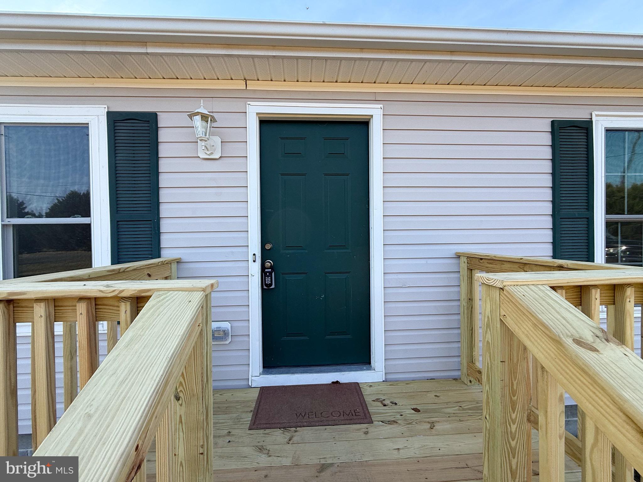 18558 Oak Road Bridgeville, DE 19933 - Photo 9 of 36 Charming entrance with welcoming green door.