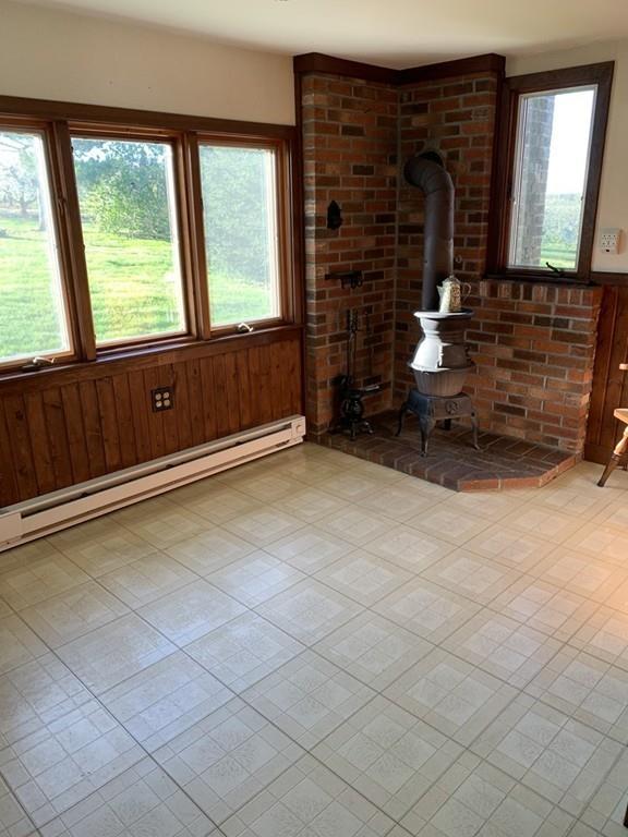 190 Chace Hill Road Sterling, MA 01564 - Photo 33 of 42 a view of an empty room with a fireplace and a large window