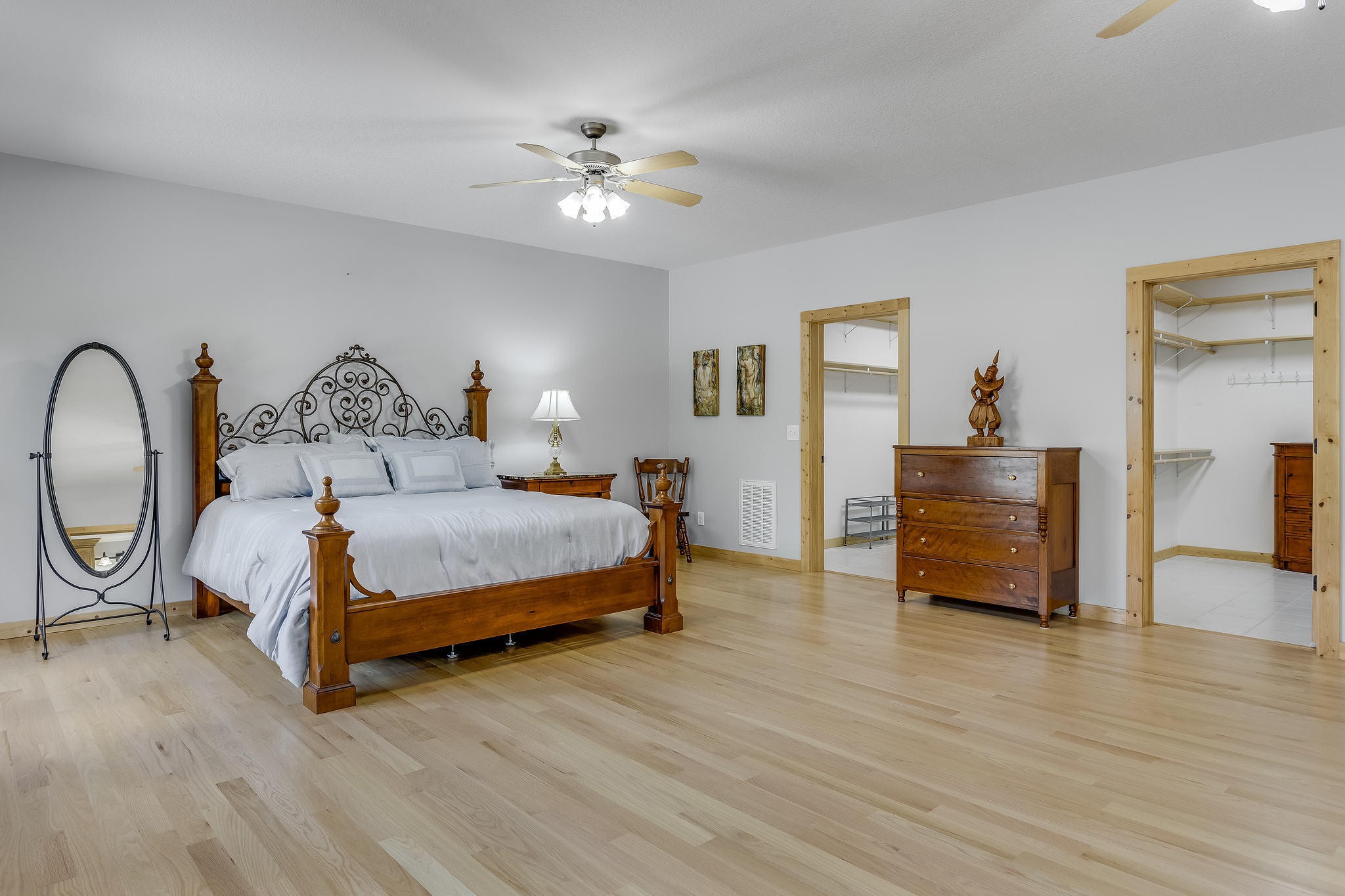 163 Kelly Ridge Road Townsend, TN 37882 - Photo 18 of 40 a bedroom with a bed a dresser and wooden floor