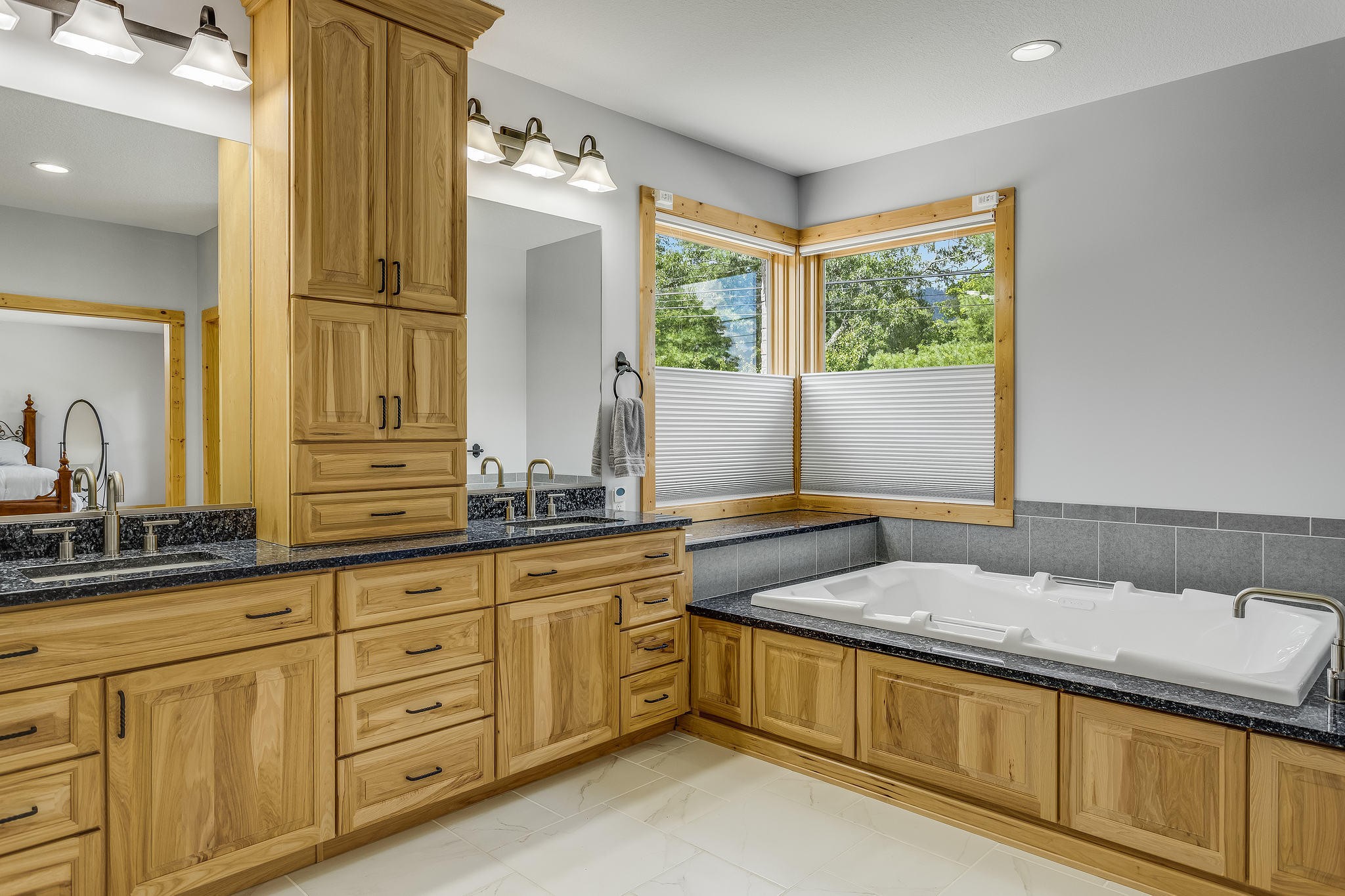 163 Kelly Ridge Road Townsend, TN 37882 - Photo 21 of 40 a bathroom with a granite countertop sink and a large mirror