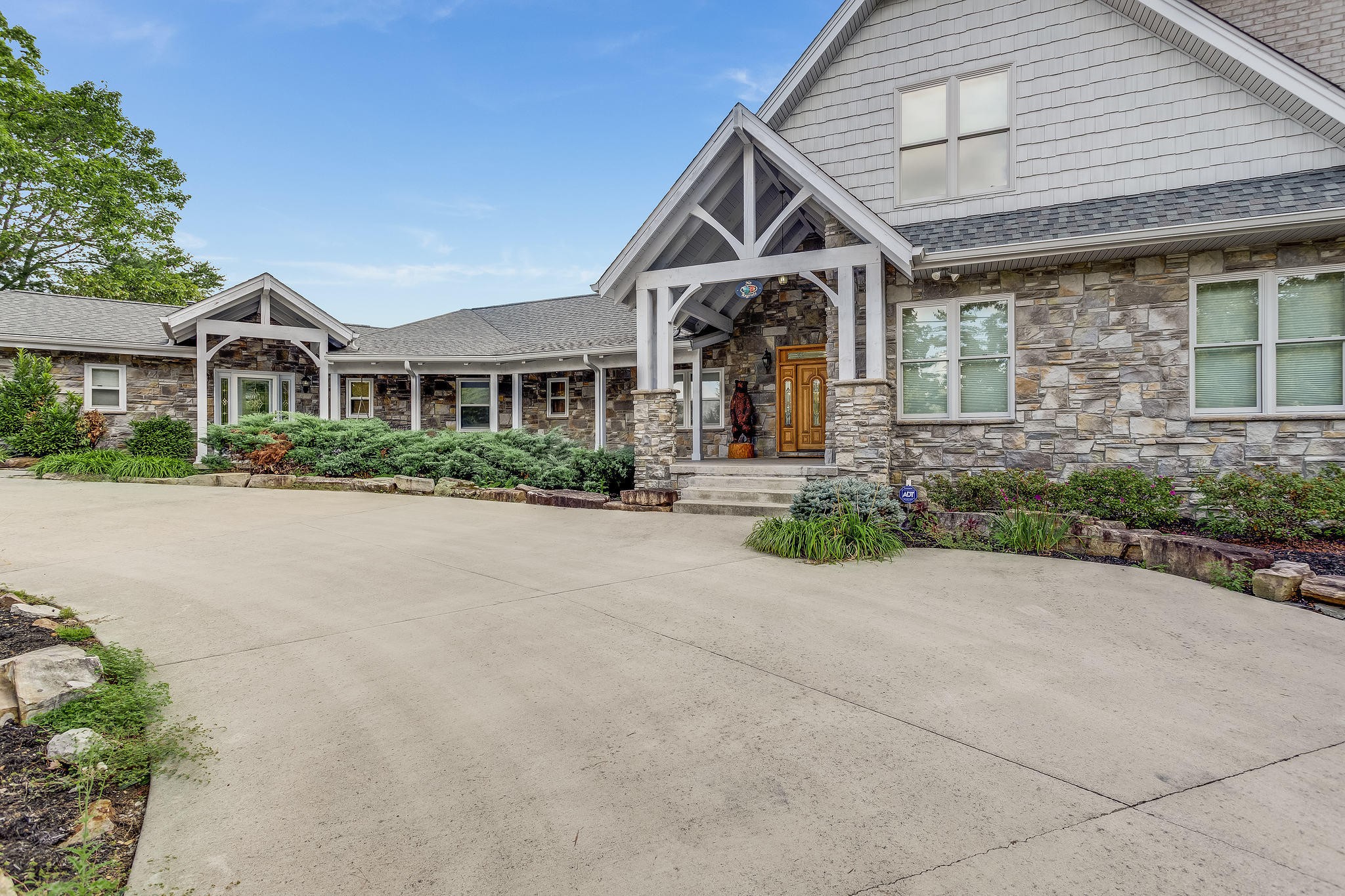 163 Kelly Ridge Road Townsend, TN 37882 - Photo 38 of 40 a front view of a house with a yard and potted plants