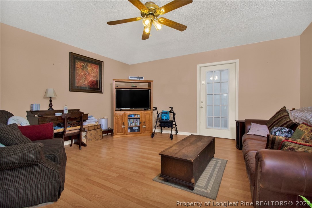 1197 Rowan Road Lumberton, NC 28358 - Photo 20 of 37 a living room with furniture and a flat screen tv