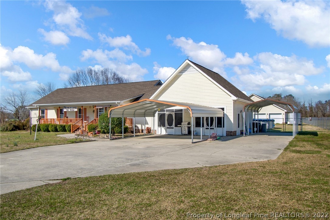 1197 Rowan Road Lumberton, NC 28358 - Photo 2 of 37 a front view of a house with a yard