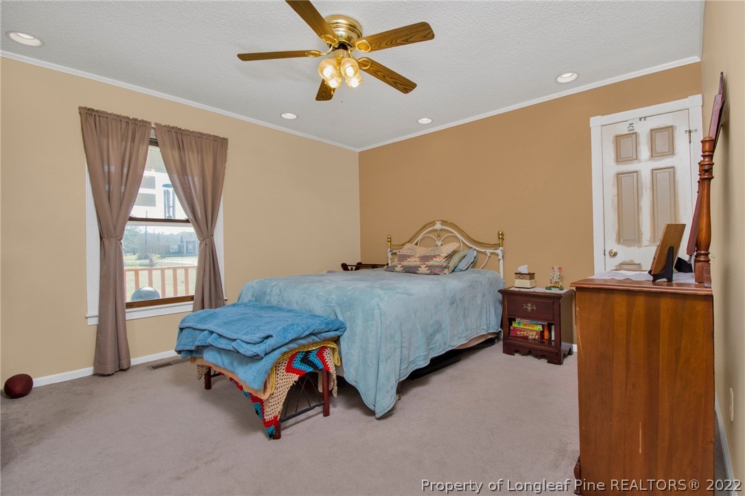 1197 Rowan Road Lumberton, NC 28358 - Photo 21 of 37 a bedroom with a bed and a window